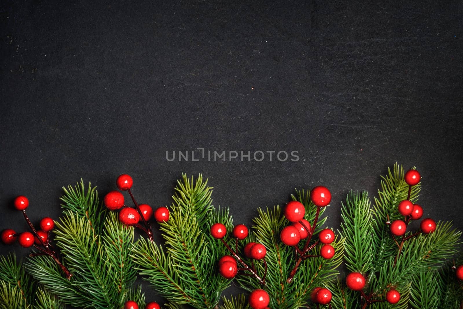Christmas background border with christmas pine tree decor on vintage dark table. Top view. Winter holiday greeting card design. Happy new year banner.