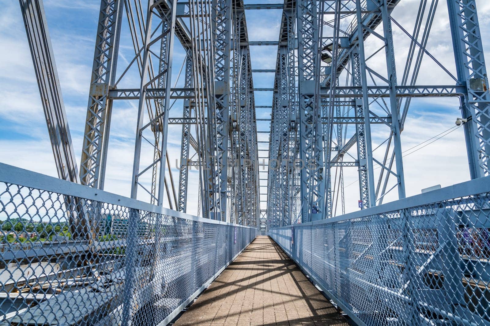 The Newport Southbank Bridge, also known as the Purple People Bridge, connects Newport, Kentucky to downtown Cincinnati, Ohio