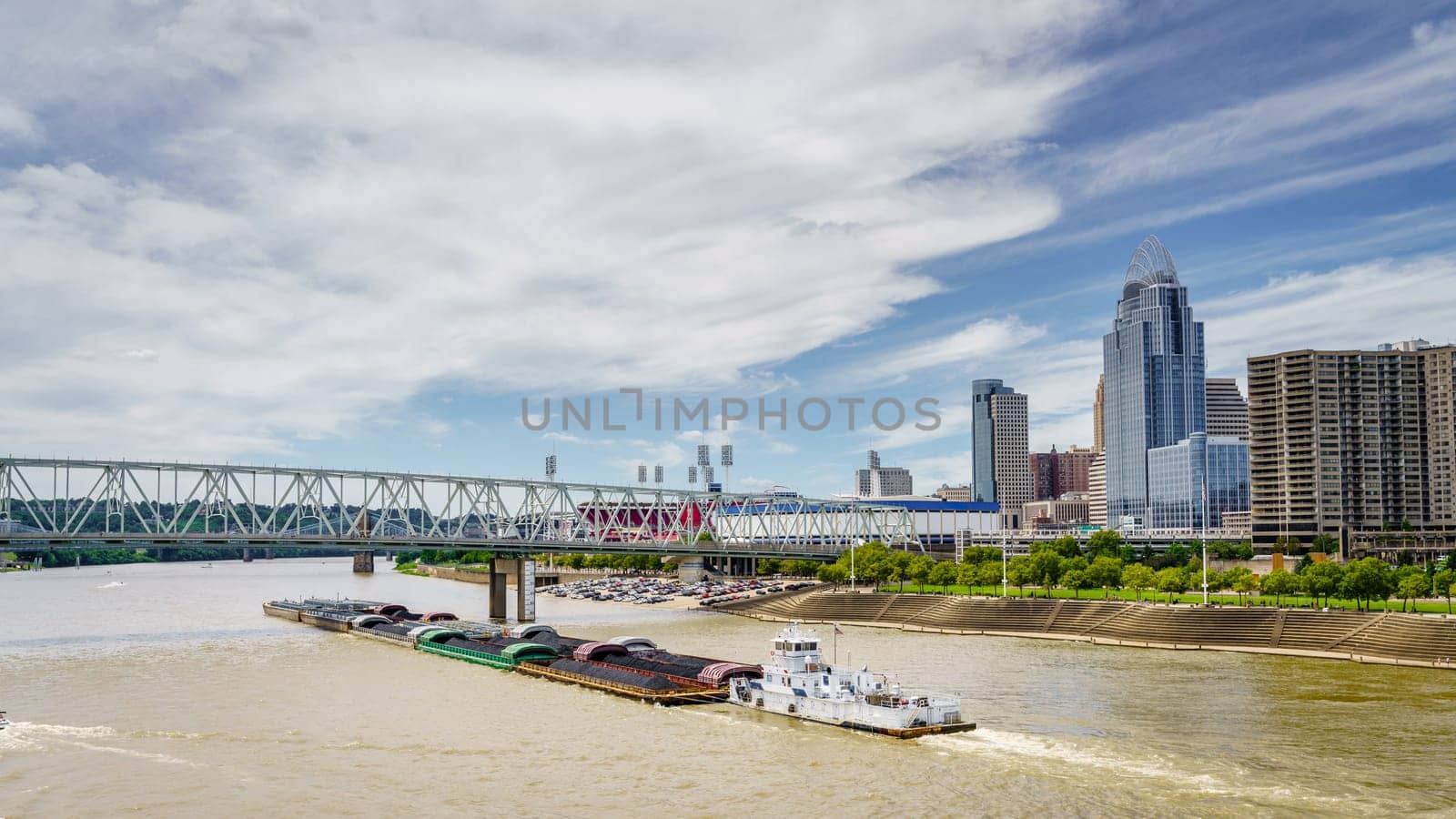 Barge travels down the Ohio River past downtown Cincinnati