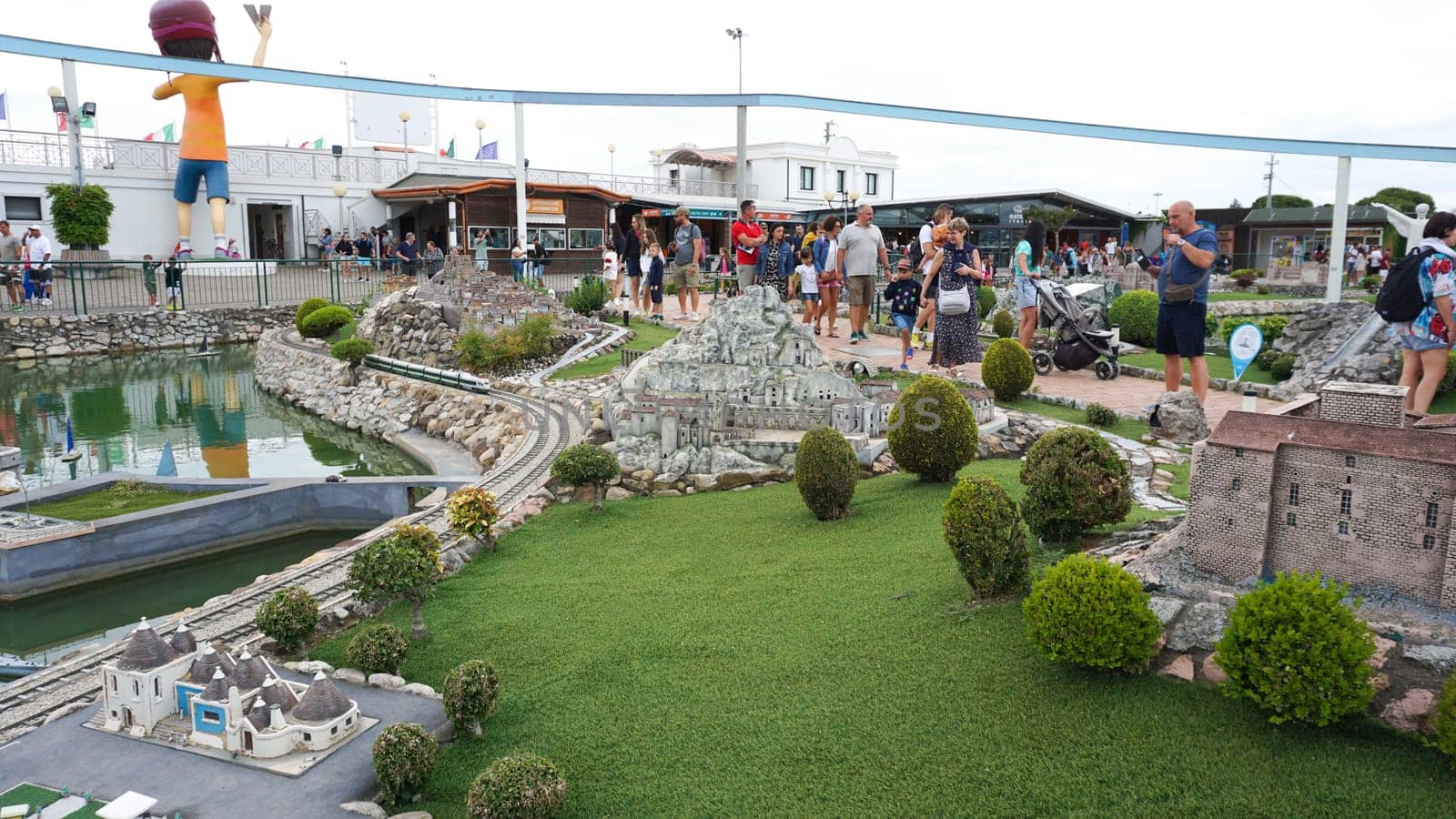 Viserba, Italy - June 25, 2024: People going at Theme park Italy in Miniature or Italia in Miniatura in Rimini, Italy - Reproduction of famous attractions in a small scale