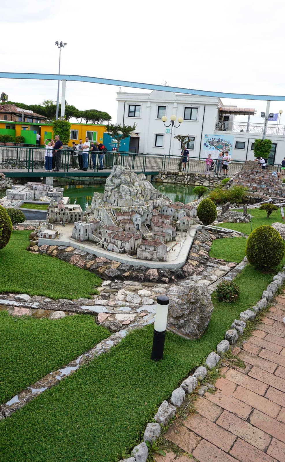 Viserba, Italy - June 25, 2024: People going at Theme park Italy in Miniature or Italia in Miniatura in Rimini, Italy - Reproduction of famous attractions in a small scale