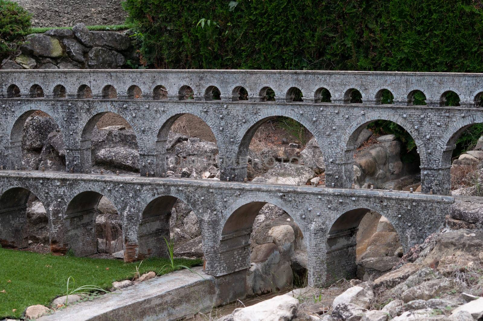 Viserba, Italy - June 25, 2024: Old bridge at Theme park Italy in Miniature or Italia in Miniatura in Rimini, Italy - Reproduction of famous attractions in a small scale
