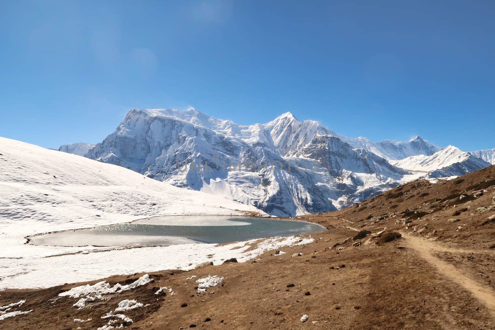 The Saano Khicho Lake in front Annapurna III, Gangapurna, Tarke Kang and Khangsar Kang, next to the Ice Lake, Kicho Tal, Khicho Ice Lake, close to Manang, Annapurna Circuit Trek, Nepal 2022