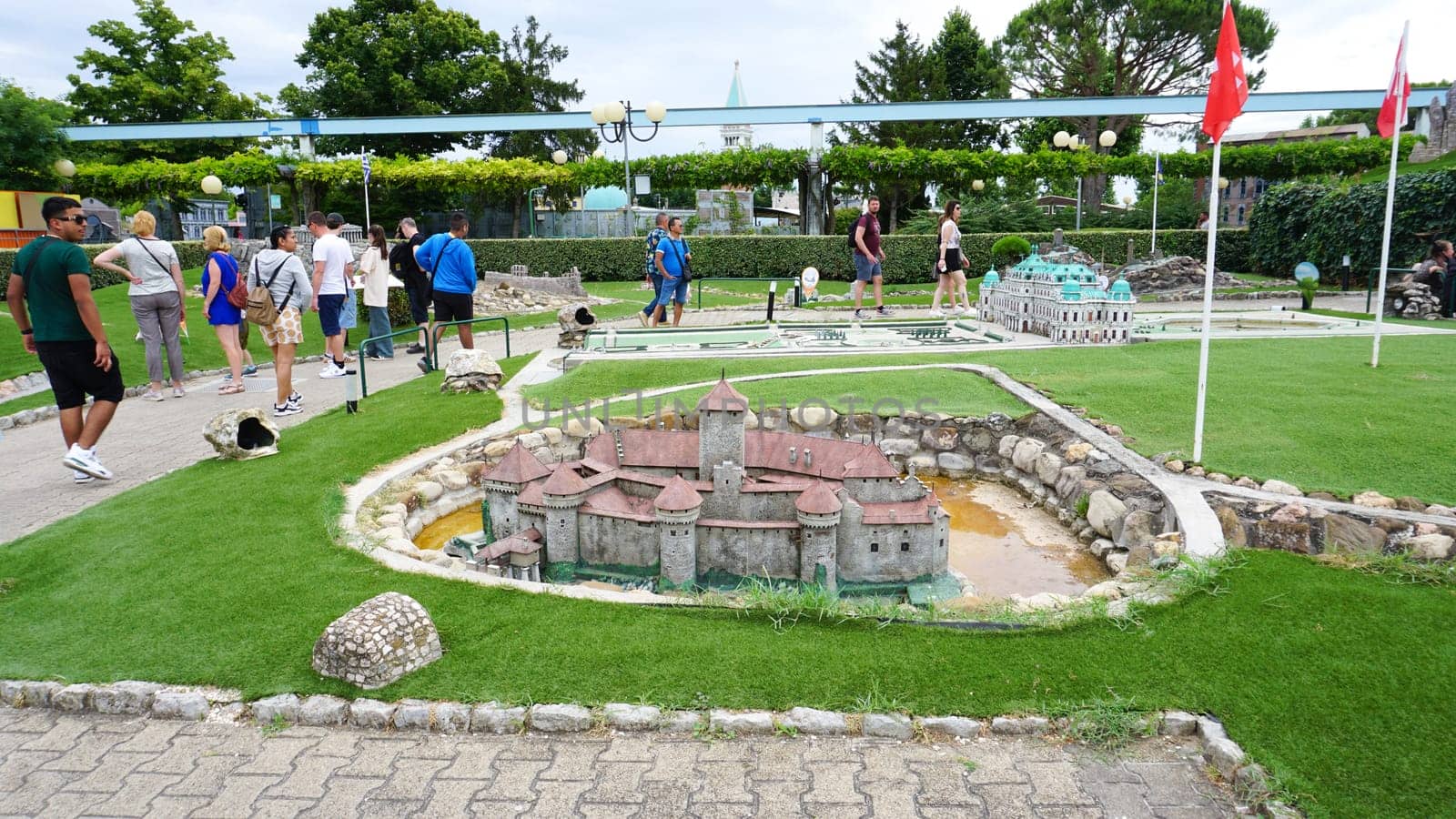 Viserba, Italy - June 25, 2024: People going at Theme park Italy in Miniature or Italia in Miniatura in Rimini, Italy - Reproduction of famous attractions in a small scale