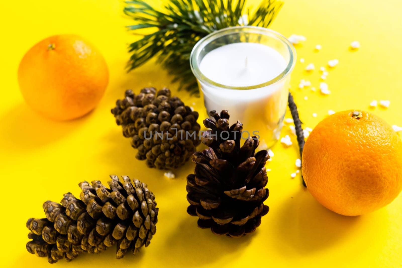 Christmas background with a fir tree branches and tangerines. Merry Christmas and Happy New Year