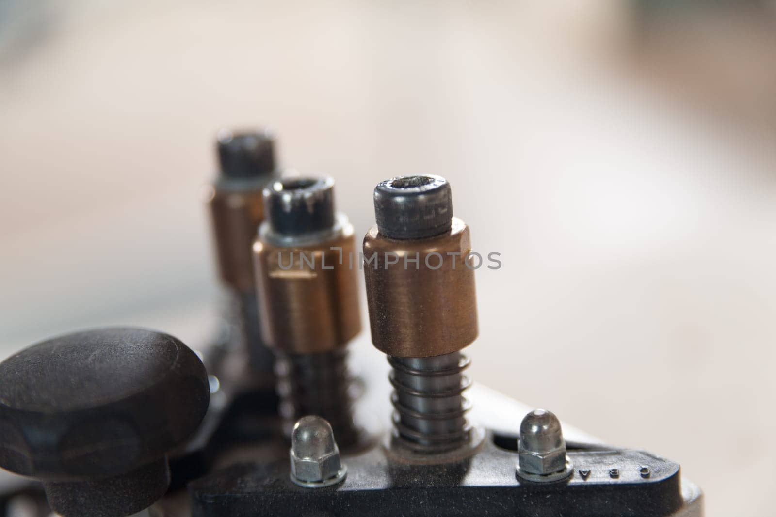 Close up of woodworking machinery parts in a busy workshop, showcasing precision and craftsmanship