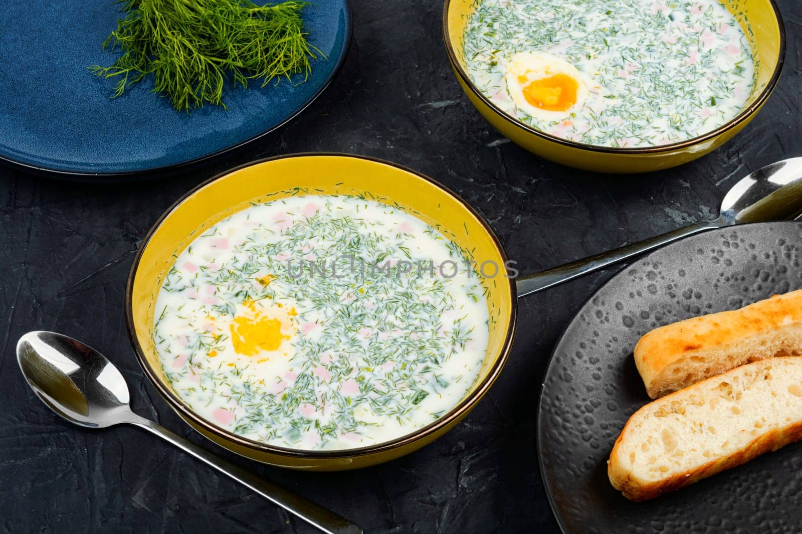 Cold soup with fresh cucumbers, sausage, broth and sour cream