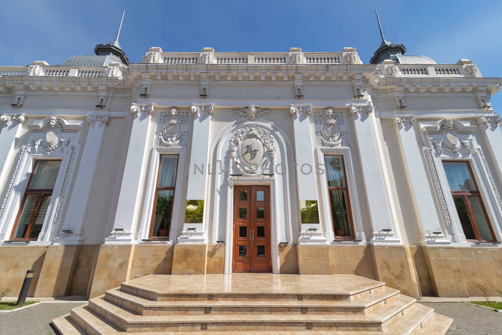 The Azerbaijan State Puppet Theatre in Baku is a beautiful building with a white facade and ornate details