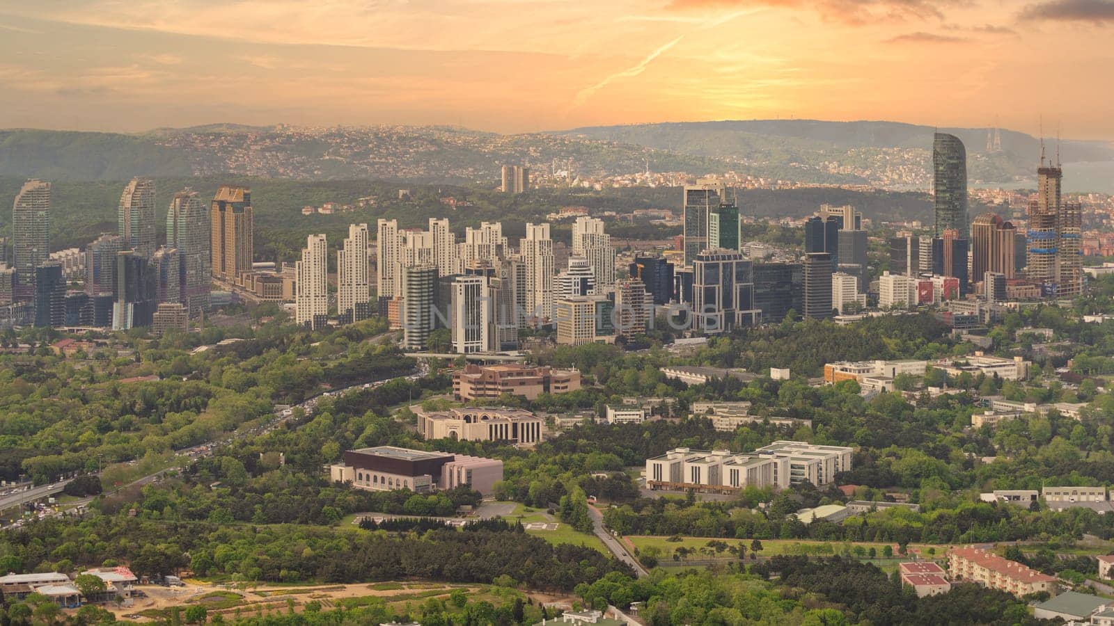 An aerial view of Istanbul's cityscape with skyscrapers and green spaces, taken from a Istanbul Sapphire skyscraper during a sunset, Turkey