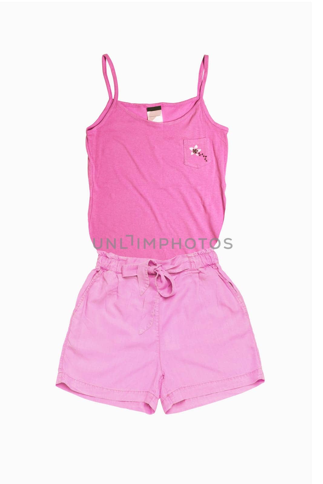 Fashionable summer clothes isolated on a white background. A female pink blouse or shirt and denim pink shorts isolated. Women fashion.