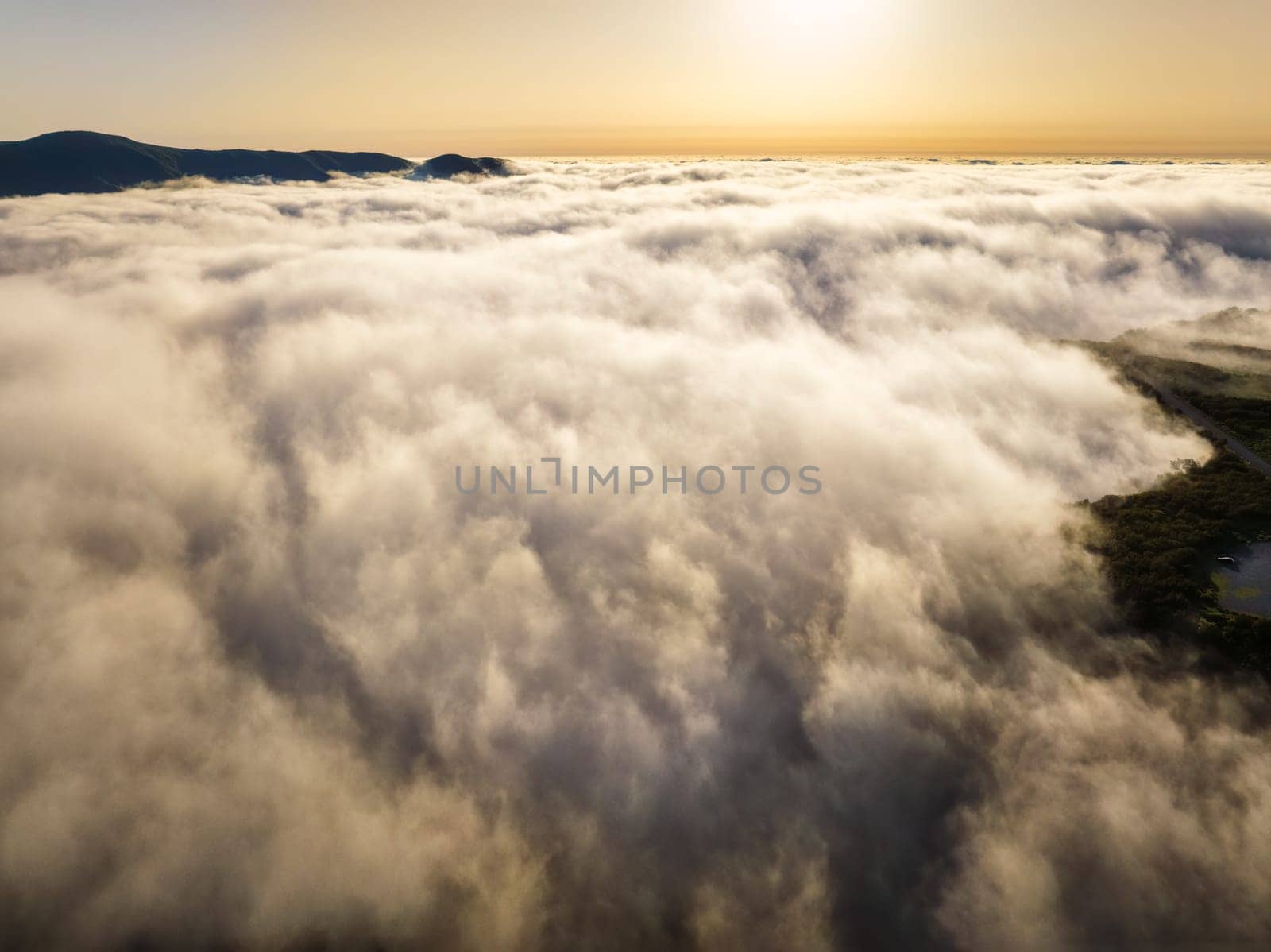 Aerial view of sunset above clouds at Fanal mountain, Madeira island, Portugal