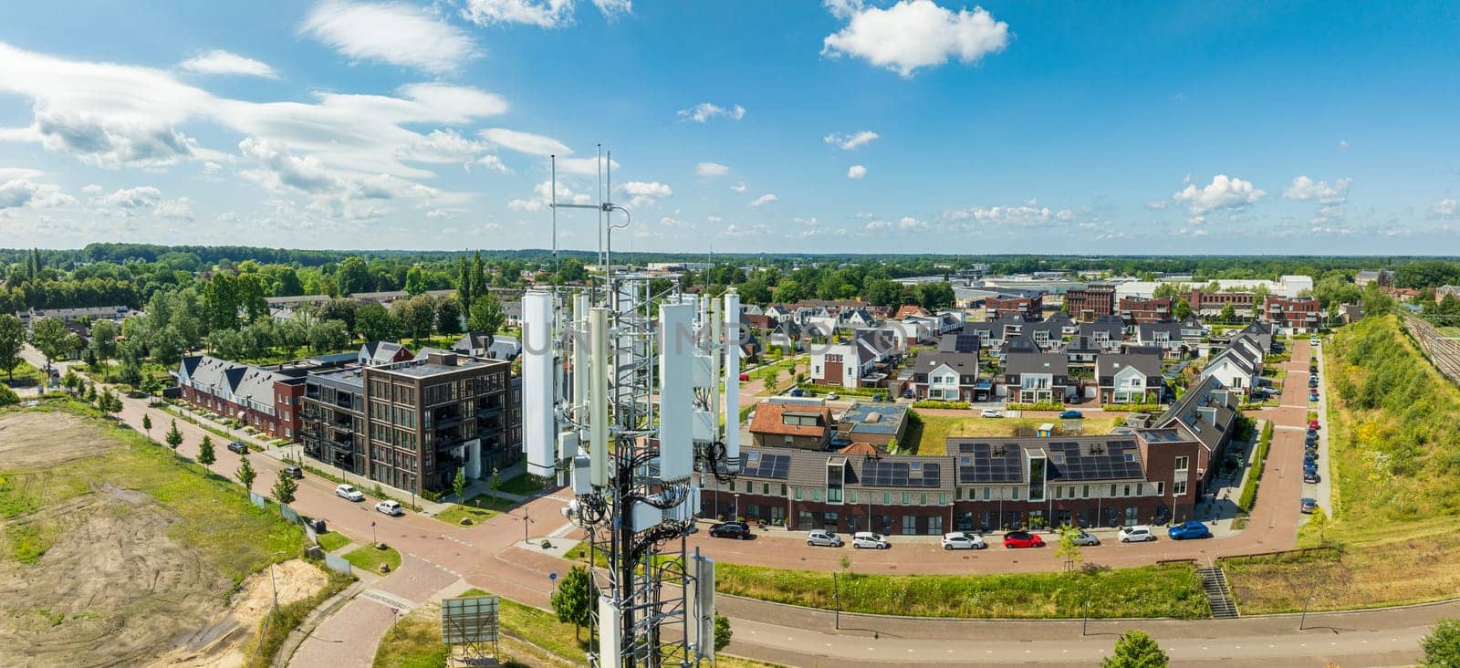 aerial view of a 5G antenna tower next to a residential area