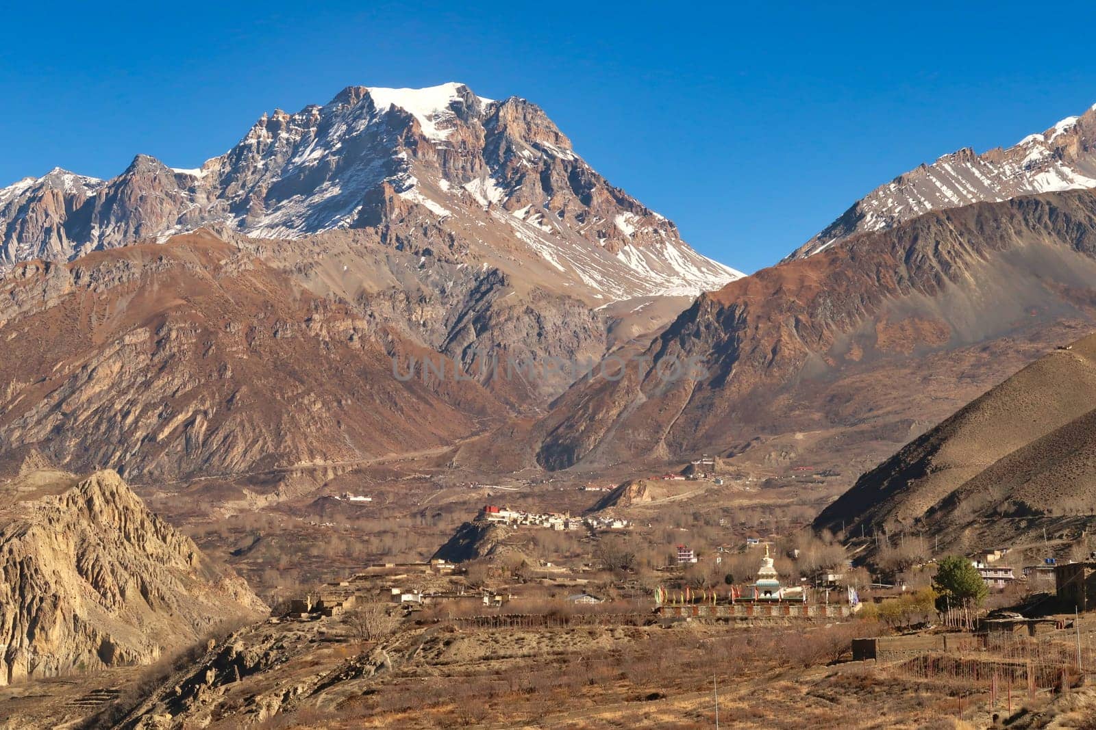 View onto Jangchup Choeten Temple, Pagoda, the village of Jharkot and the town of Muktinath in front of the Thorong, Thorung La Pass, Annapurna Circuit Trek, Nepal 2022