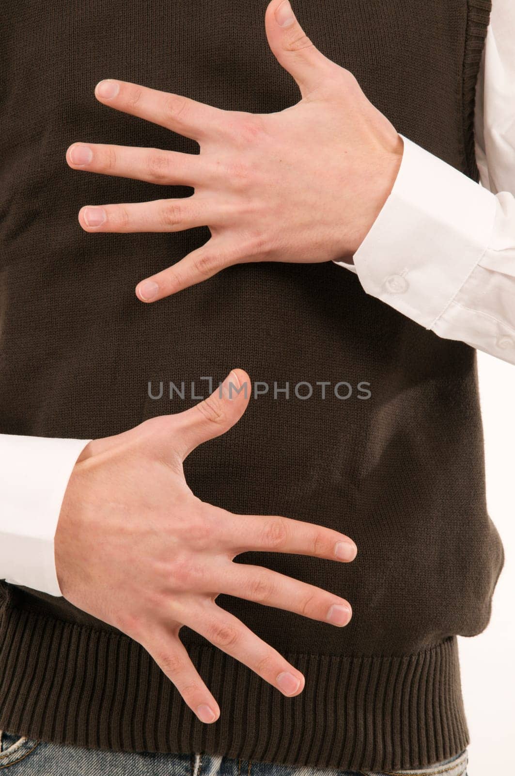 Two male hands held in front of the stomach symbolize the number 10 with the fingers.