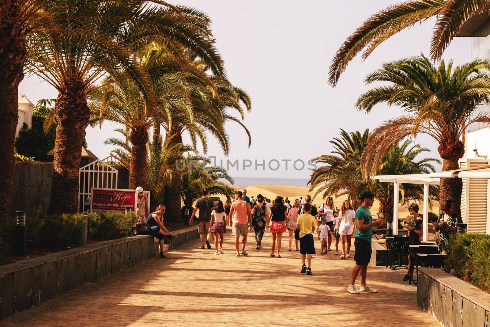 Gran Canaria, Spain, Canary Islands, Playa del Inglés - Jun 17, 2024. Tourist at a viewpoint of Dunes de Maspalomas. Maspalomas Dunes Nature Reserve.