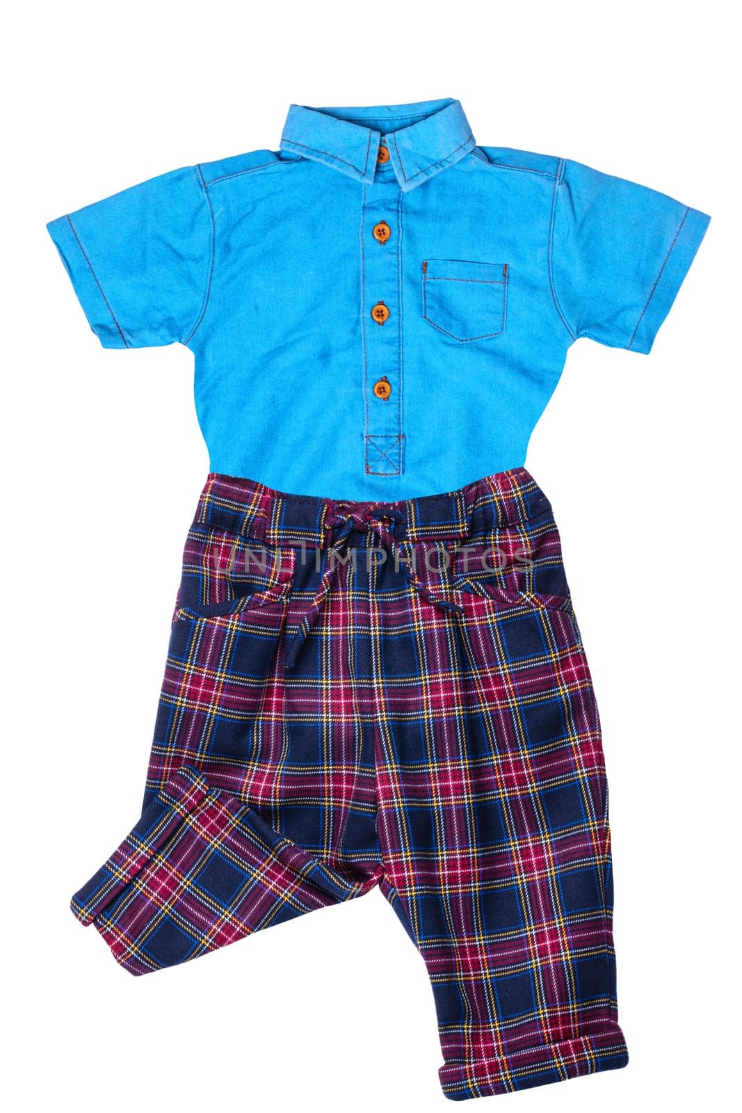 A stylish fashionable plaid short pants with elastic and bow and a blue jeans shirt for kids isolated on a white background.  Short sleeve shirt summer fashion.