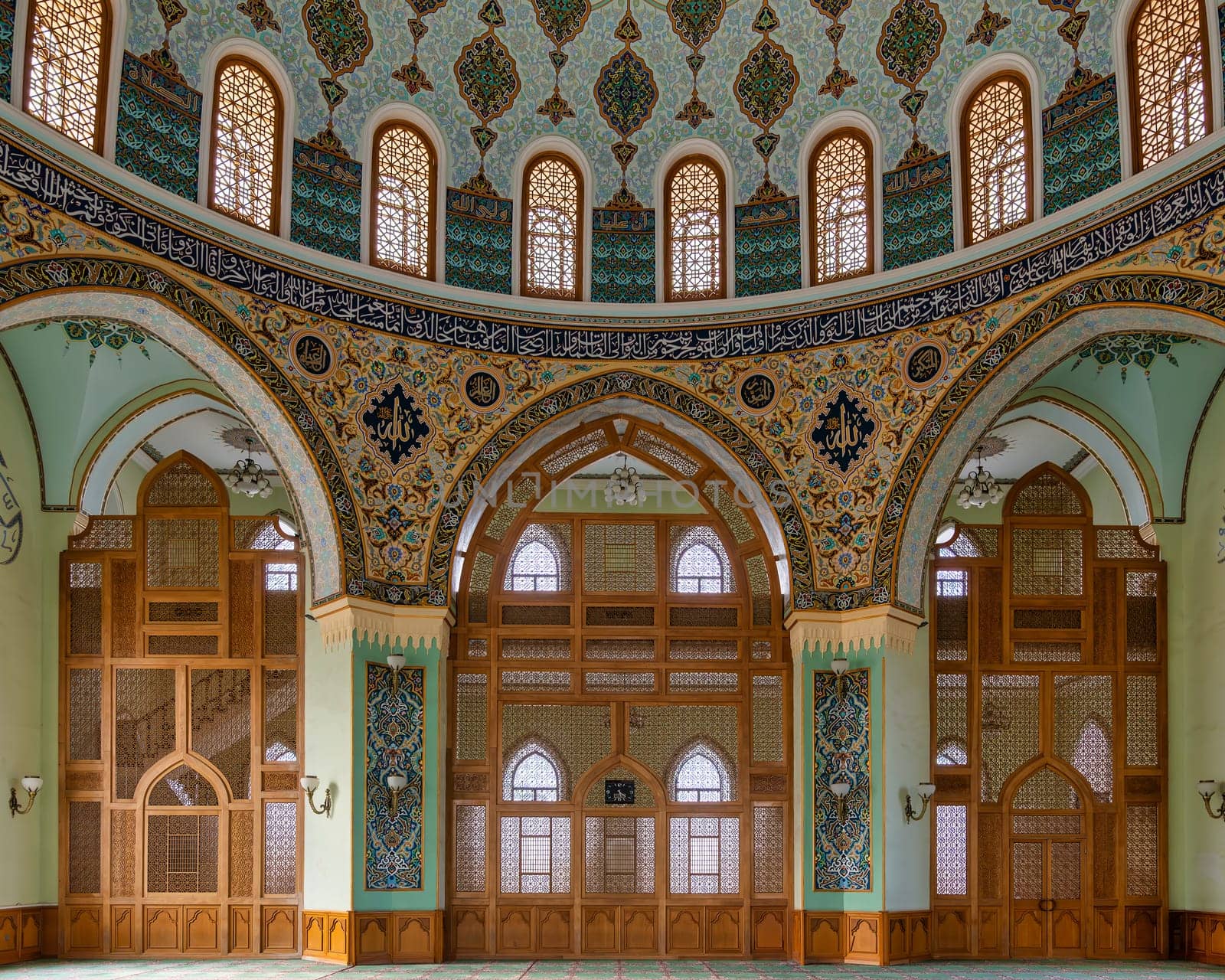 Interior of Taza Pir Mosque in Baku, Azerbaijan, admire its ornate dome and intricate architecture blending traditional Islamic motifs with modern elements