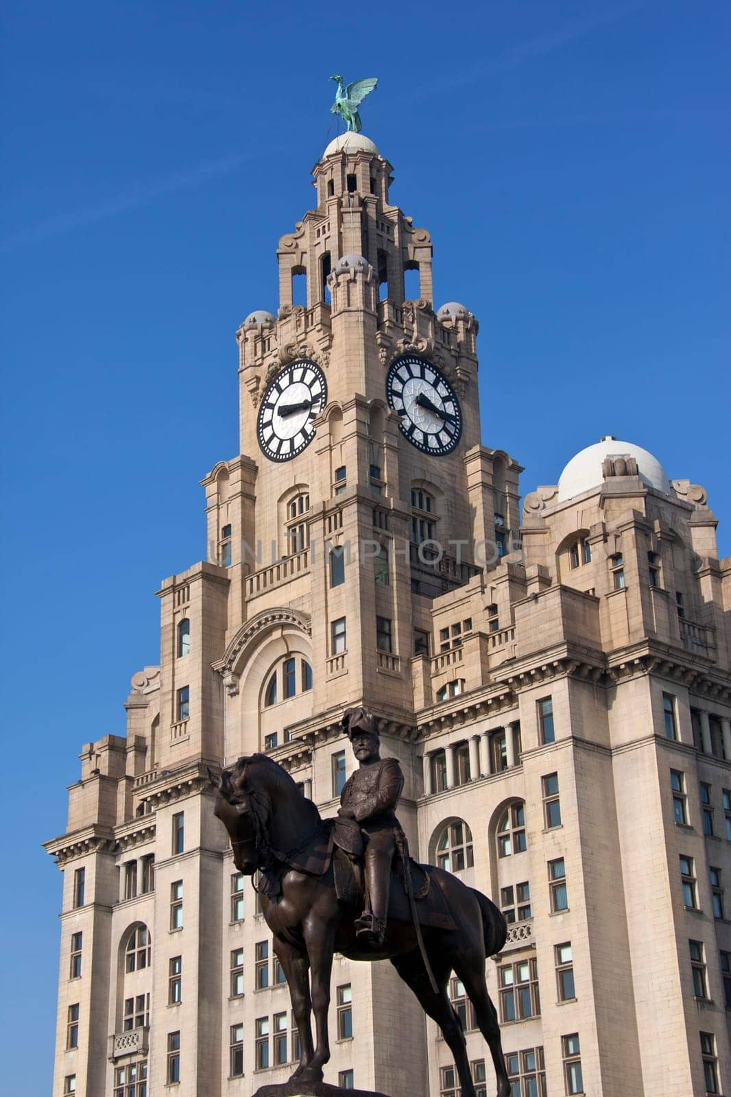 The iconic Liver Building and statue of King Edward VII on the waterfront of the River Mersey in the city of Liverpool in the northwest of England.