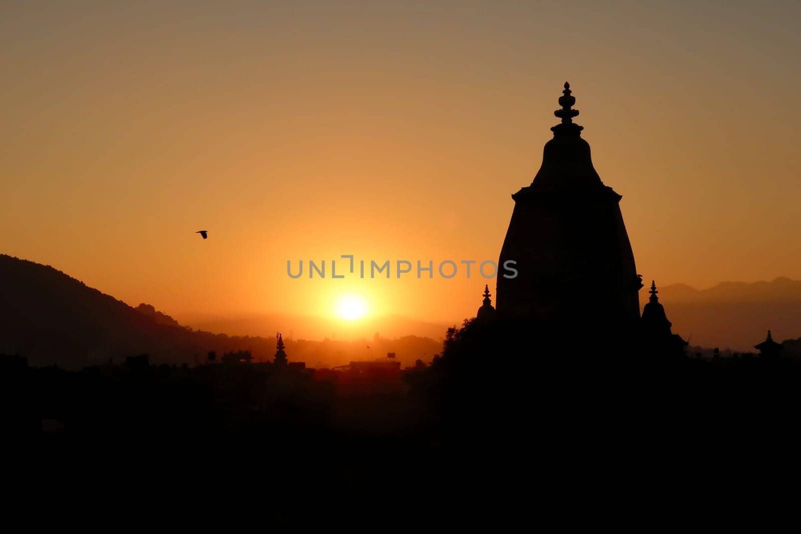 The silhouette, contour of the Shilu, Silu Mahadeva, Mahadev Temple and the skyline of the old town of Bhaktapur at sunset, Bhaktapur, Nepal 2022