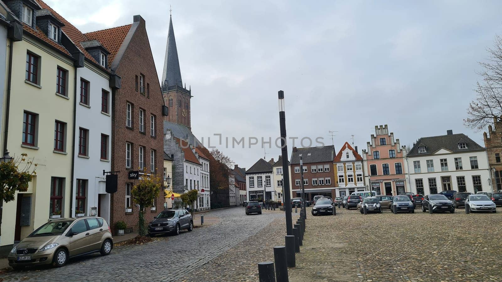 KALKAR NRW, GERMANY - NOVEMBER 14, 2021: Trees and houses in the city against the sky in autumn
