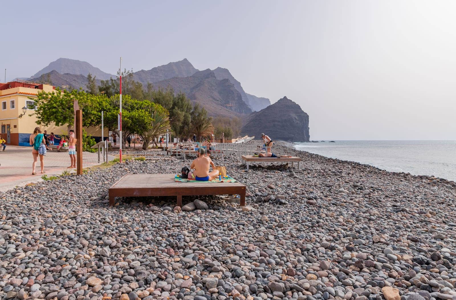 Gran Canaria, Spain: March 17, 2024: People at the black sand beach paradise in La Aldea, Gran Canaria, Canary islands, Spain