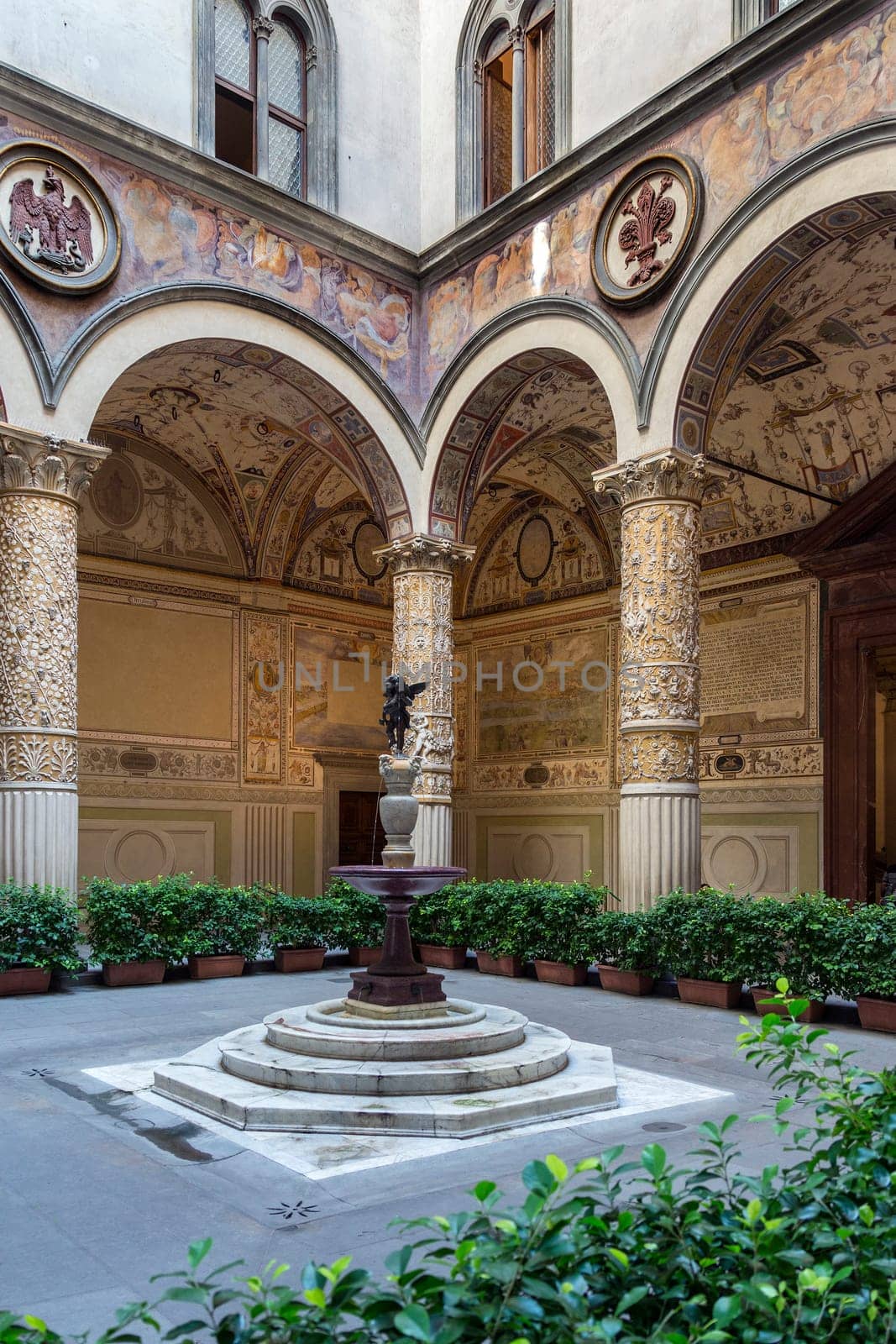 Interior courtyard in the Palazzo Vecchio (Old Palace) is the town hall of the city of Florence, Italy. It overlooks the Piazza della Signoria with its copy of Michelangelo's David statue. The historic center of Florence (Firenze) is a UNESCO World Heritage Site.