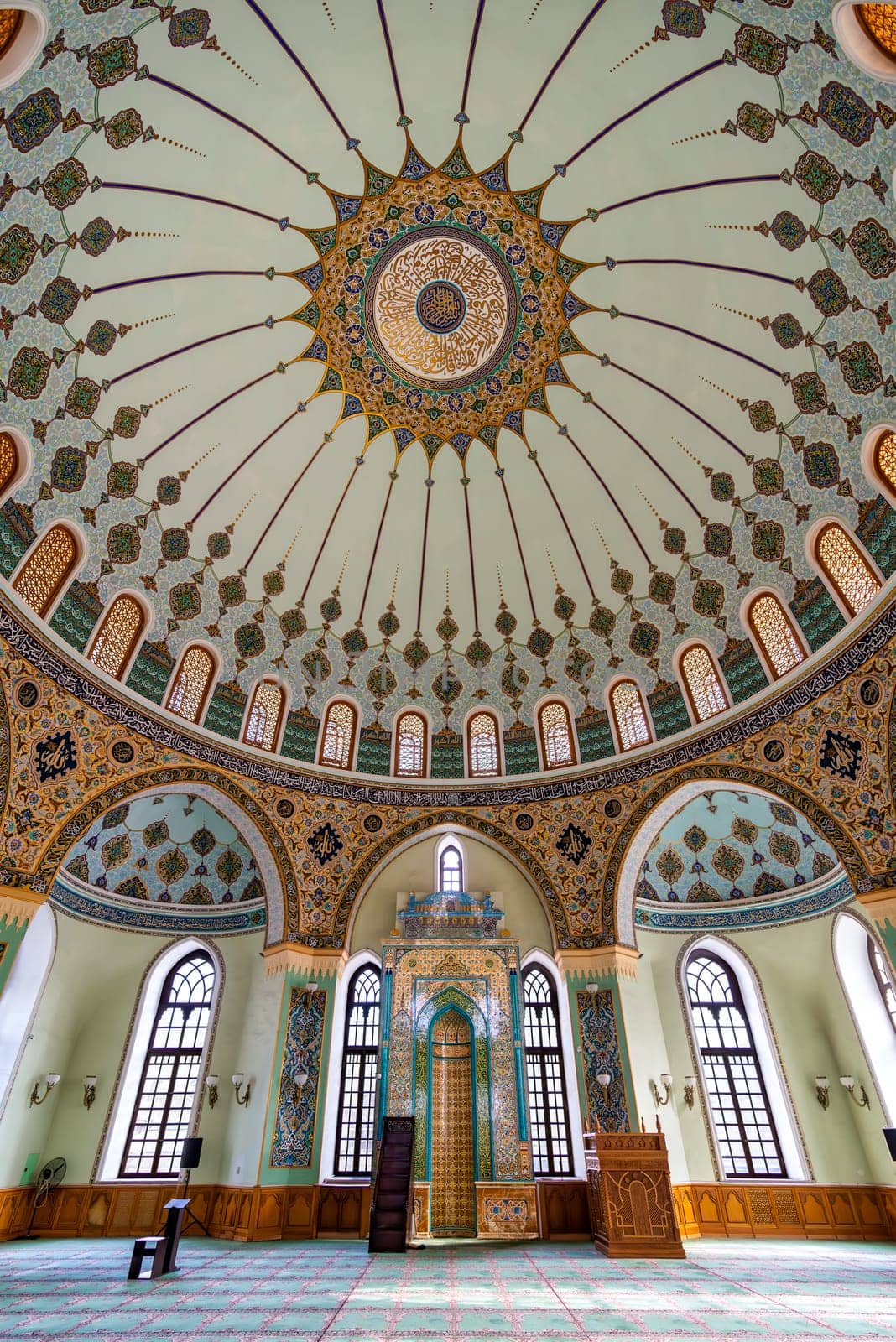 Interior of Taza Pir Mosque in Baku, Azerbaijan, admire its ornate dome and intricate architecture blending traditional Islamic motifs