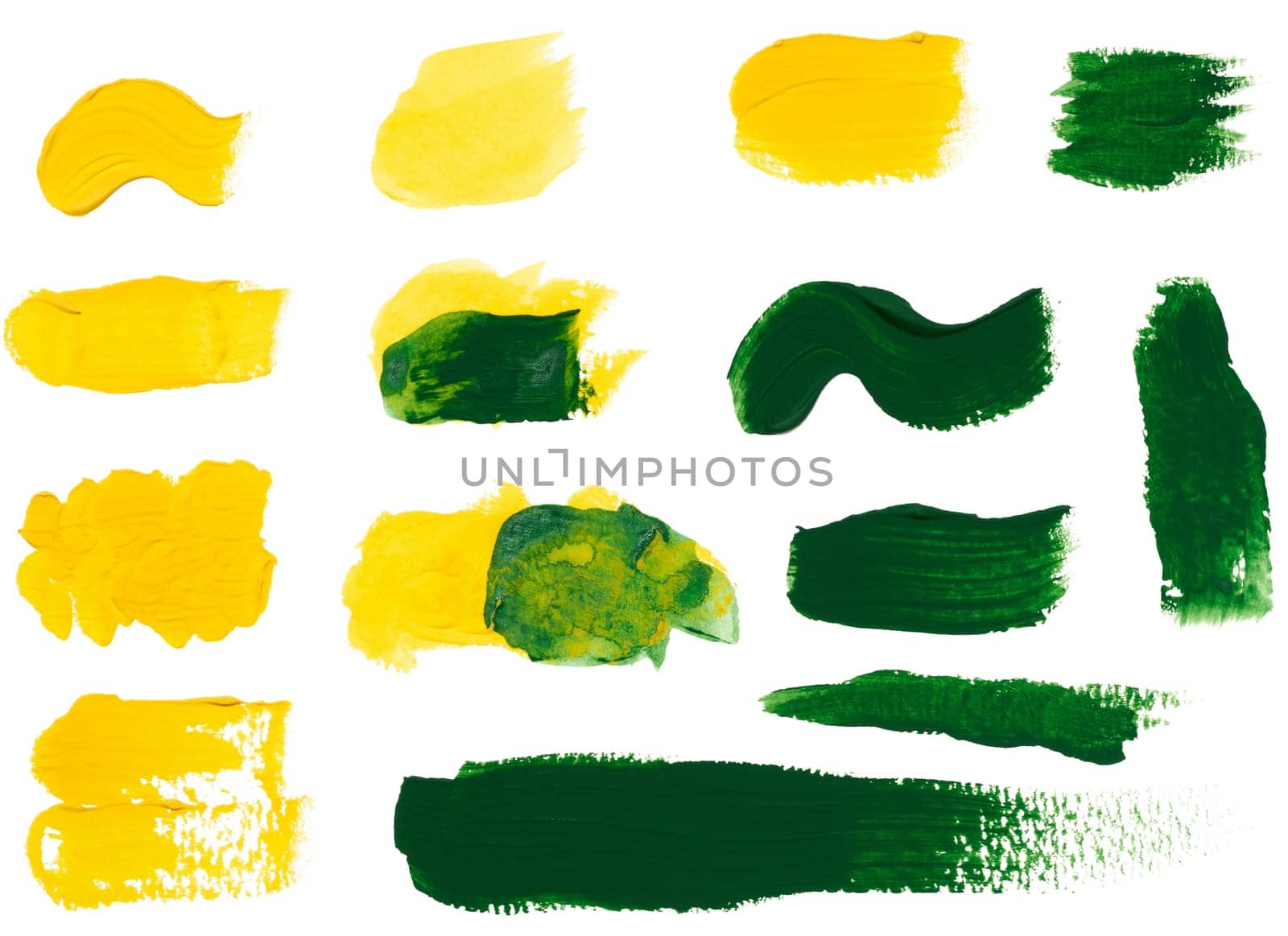 Yellow and green strokes of acrylic paint on a white background