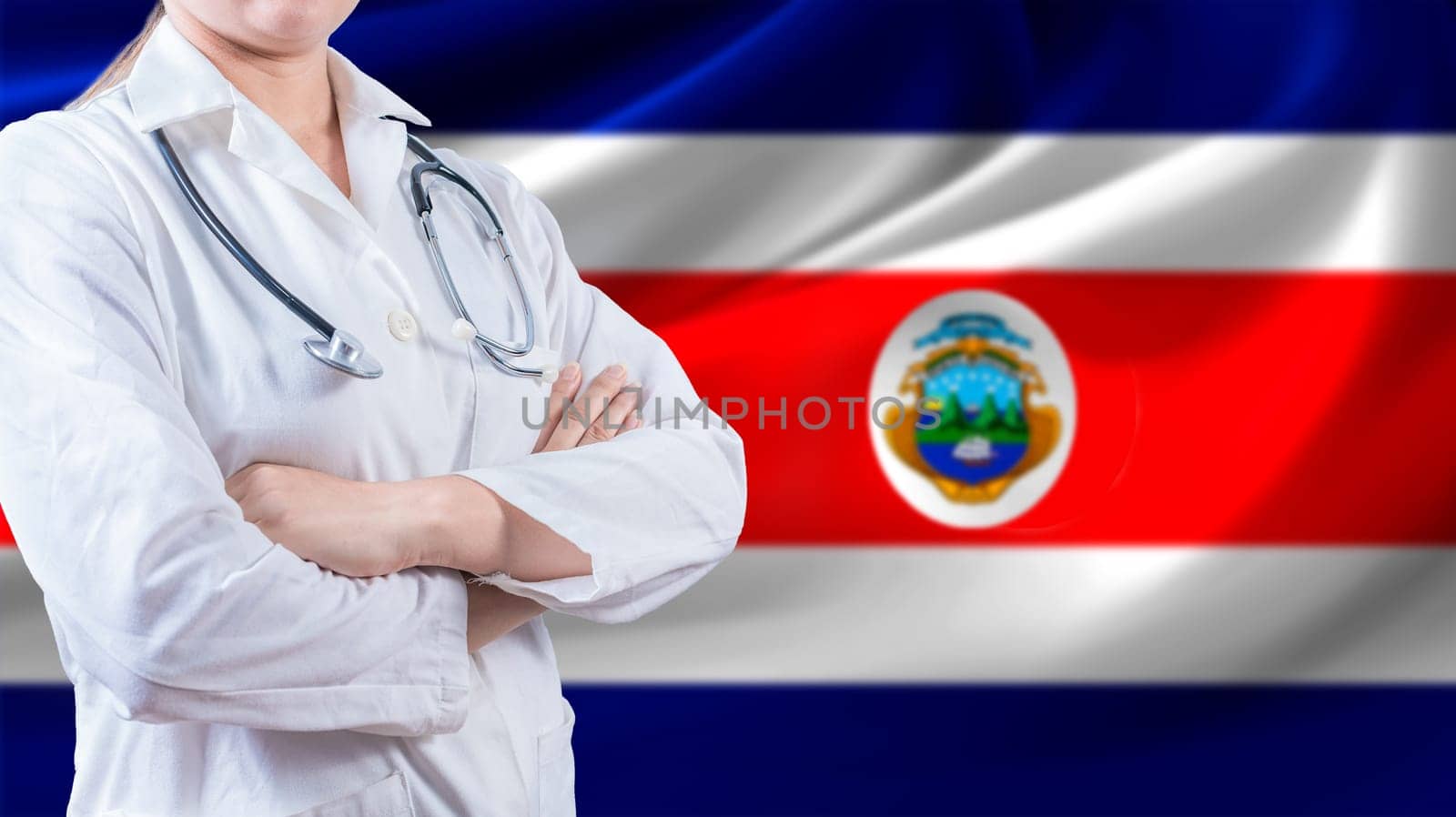 Female doctor with crossed arms with Costa Rican flag in the background. Health care concept with Costa Rica flag in background