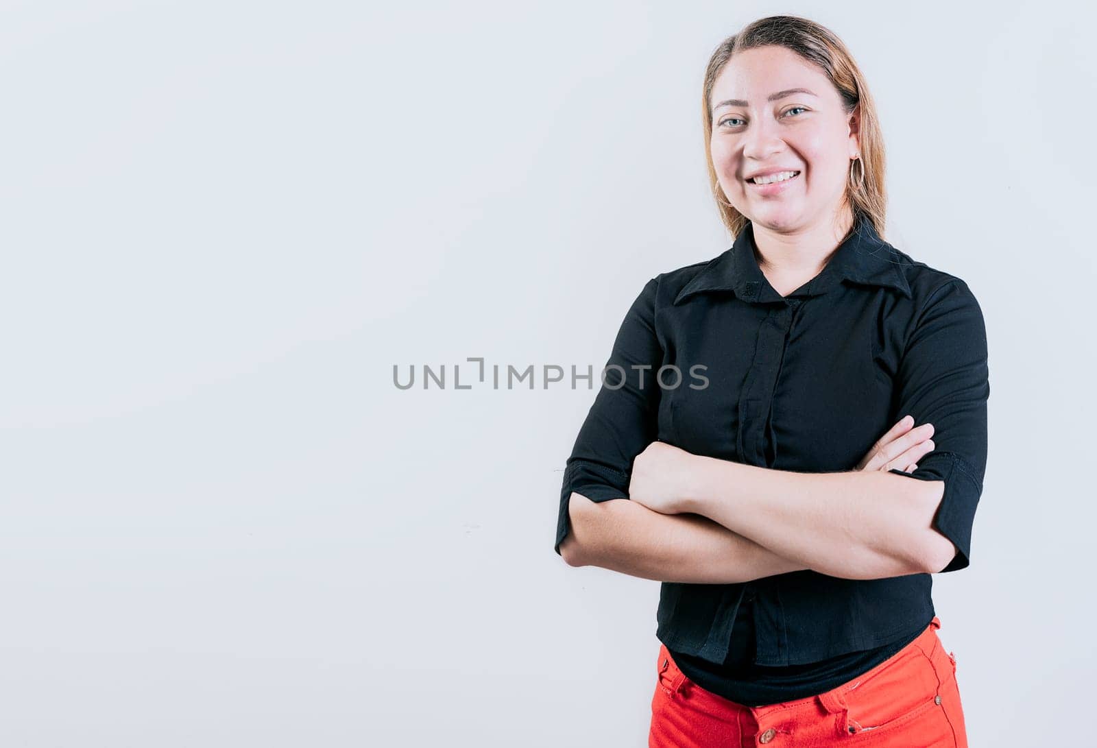 Beautiful young latin woman with arms crossed isolated. Attractive latin woman with arms crossed isolated. Latin people with arms crossed isolated