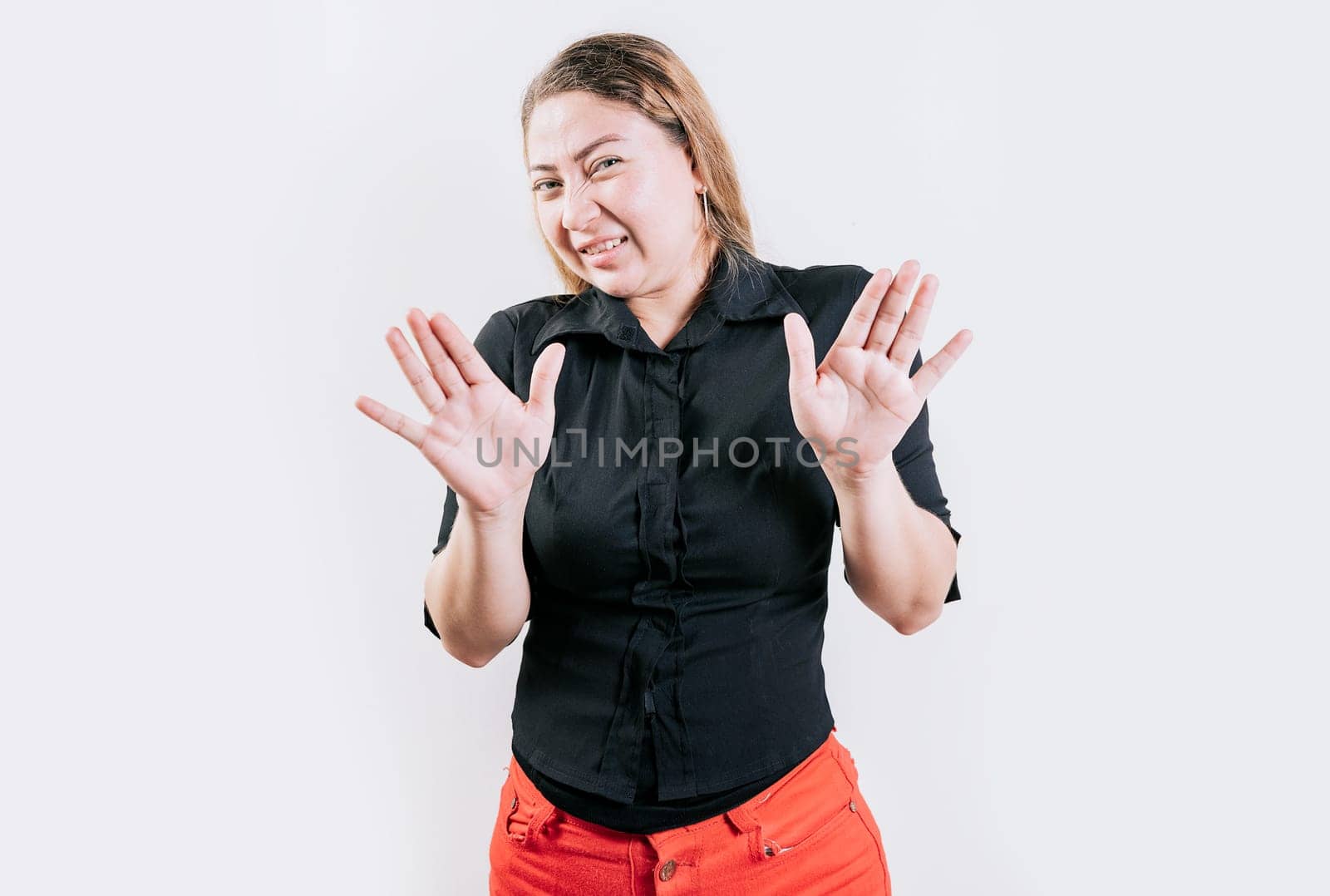 People with face disgusted on isolated background.. Person with disgust face isolated. Latin girl with expression of disgust isolated