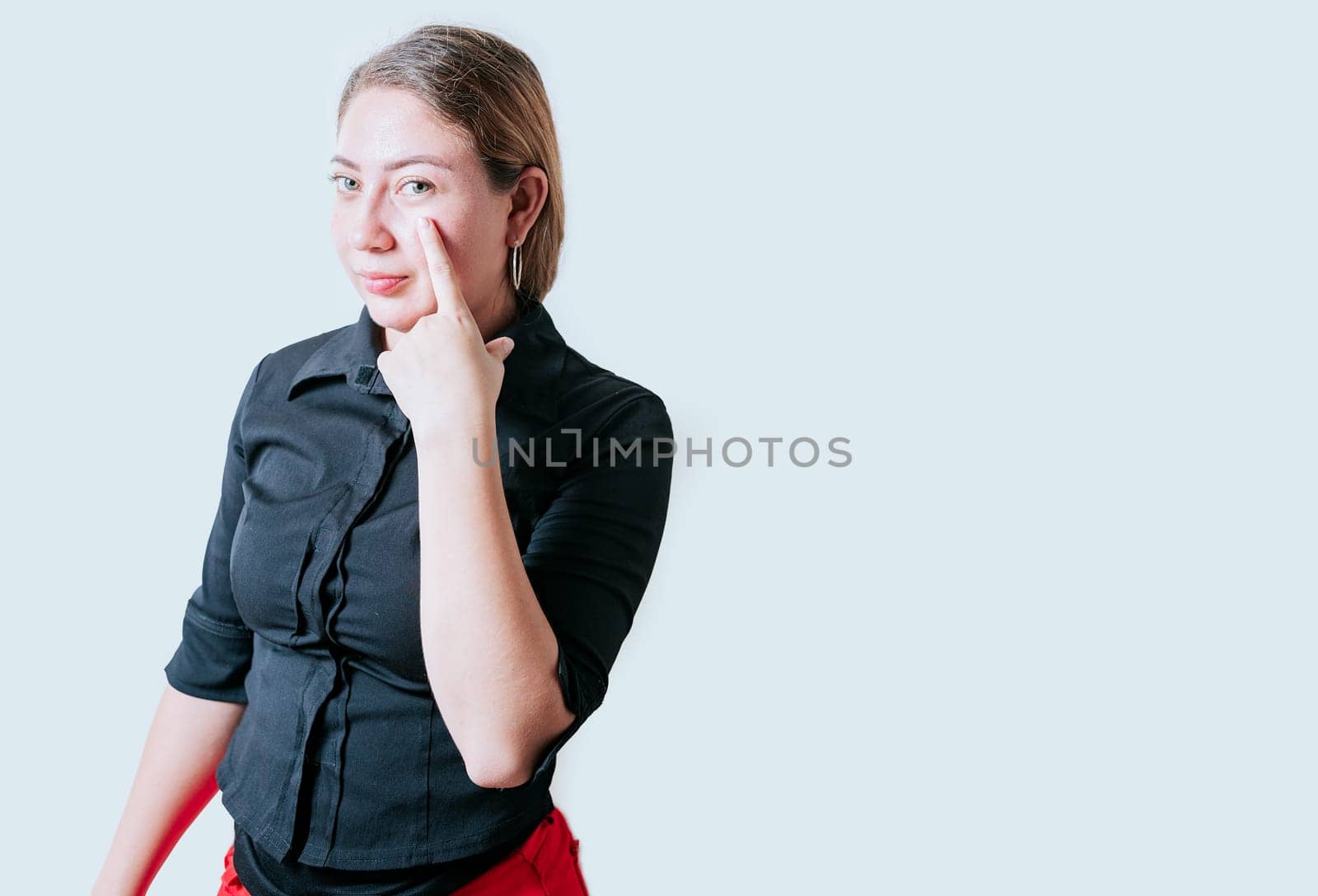 Distrustful girl looking at you. Distrustful beautiful girl looking at you with suspicion