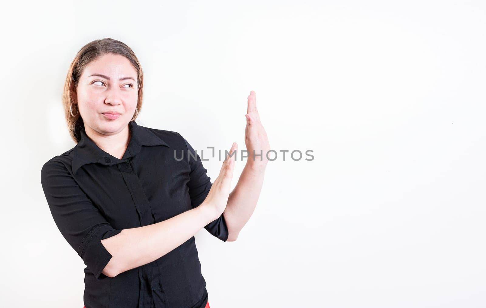 Displeased young woman rejecting with palms hands isolated. Disgusted young woman with rejection gesture. He frowns in disgust
