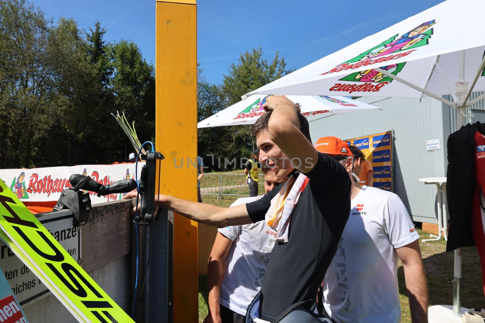 Will it be enough for the podium? Luca Roth (SV Messstetten) looks at the scoreboard and celebrates second place at the COC Cup Summer Ski Jumping Hinterzarten 2024