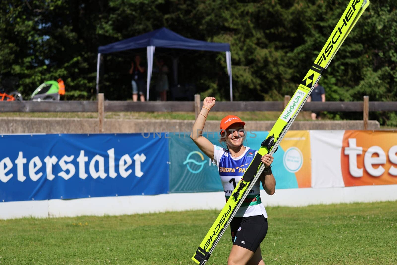 Enjoy the moment with the day's victory: Katharina Schmid (SC Oberstdorf) at the award ceremony for the COC Cup Summer Ski Jumping Hinterzarten 2024
