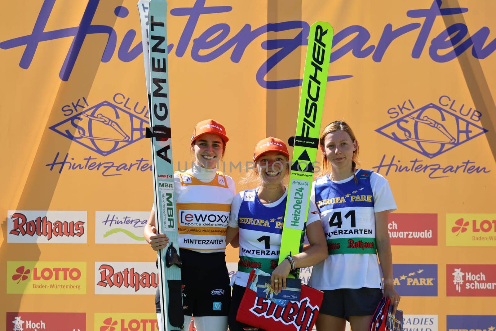 Beaming women at the award ceremony: v.li. Selina Freitag (WSC Erzgebirge Oberwiesenthal),Katharina Althaus (SC Oberstdorf) and Karolina Indrackova (Czech Republic/CZE) at the COC Cup Summer Ski Jumping Hinterzarten 2024