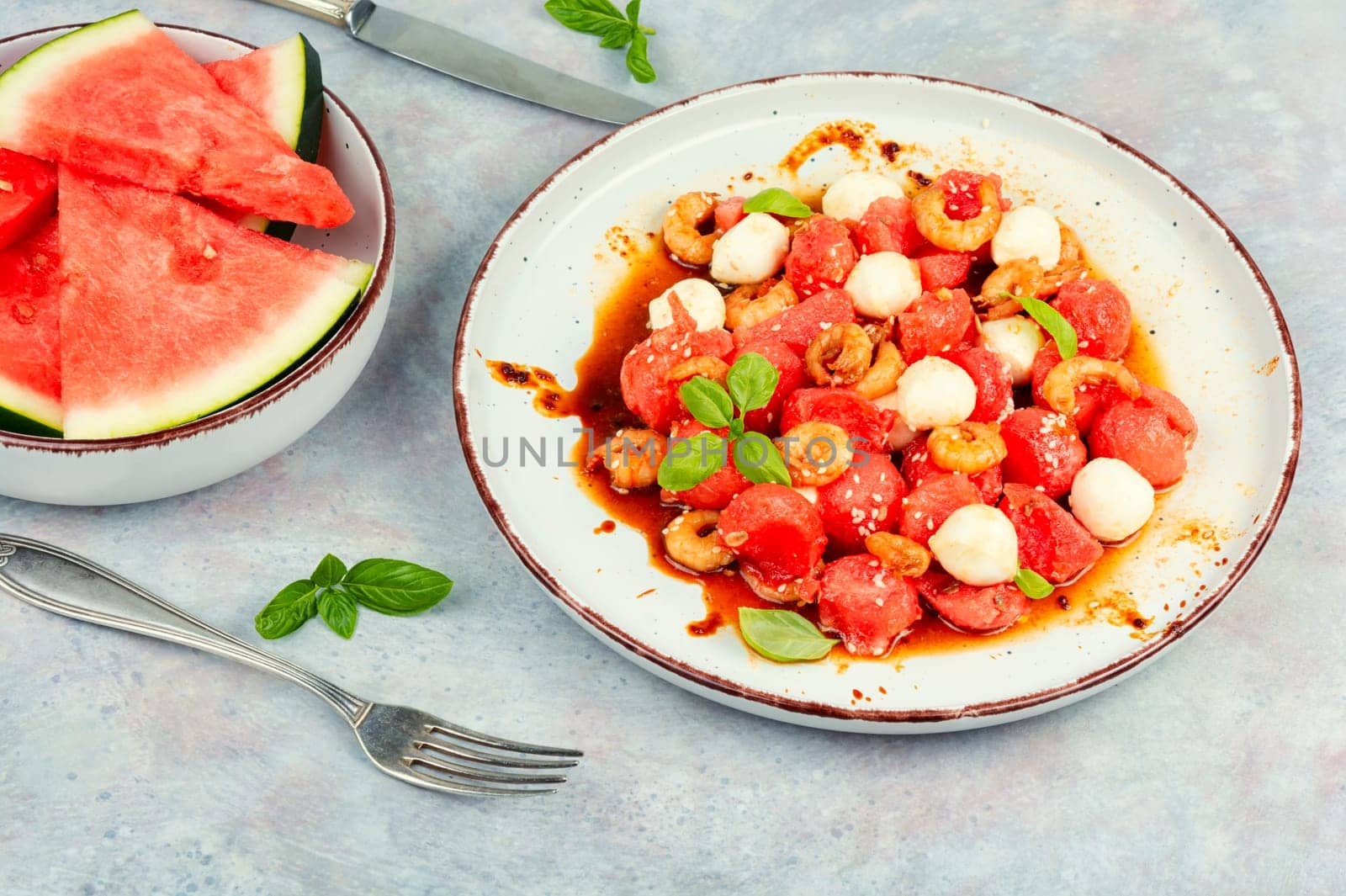 Summer salad with watermelon, mozzarella cheese and shrimp.
