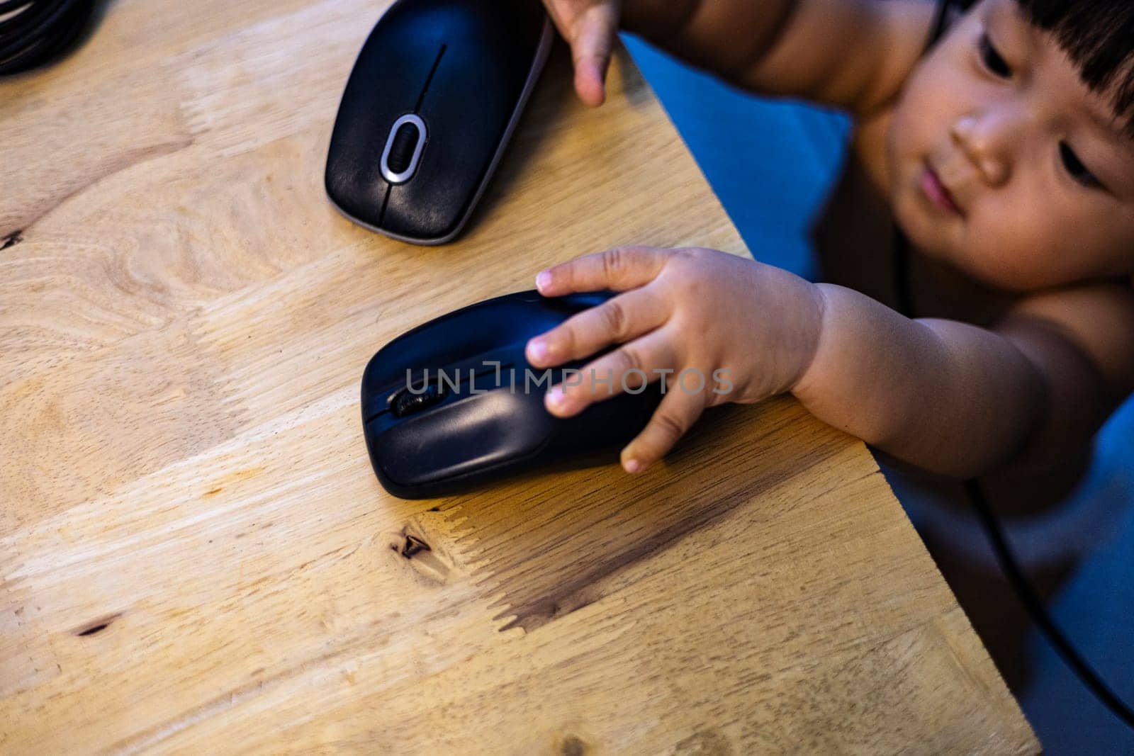 Selective focus. Close up of hand holding mouse.