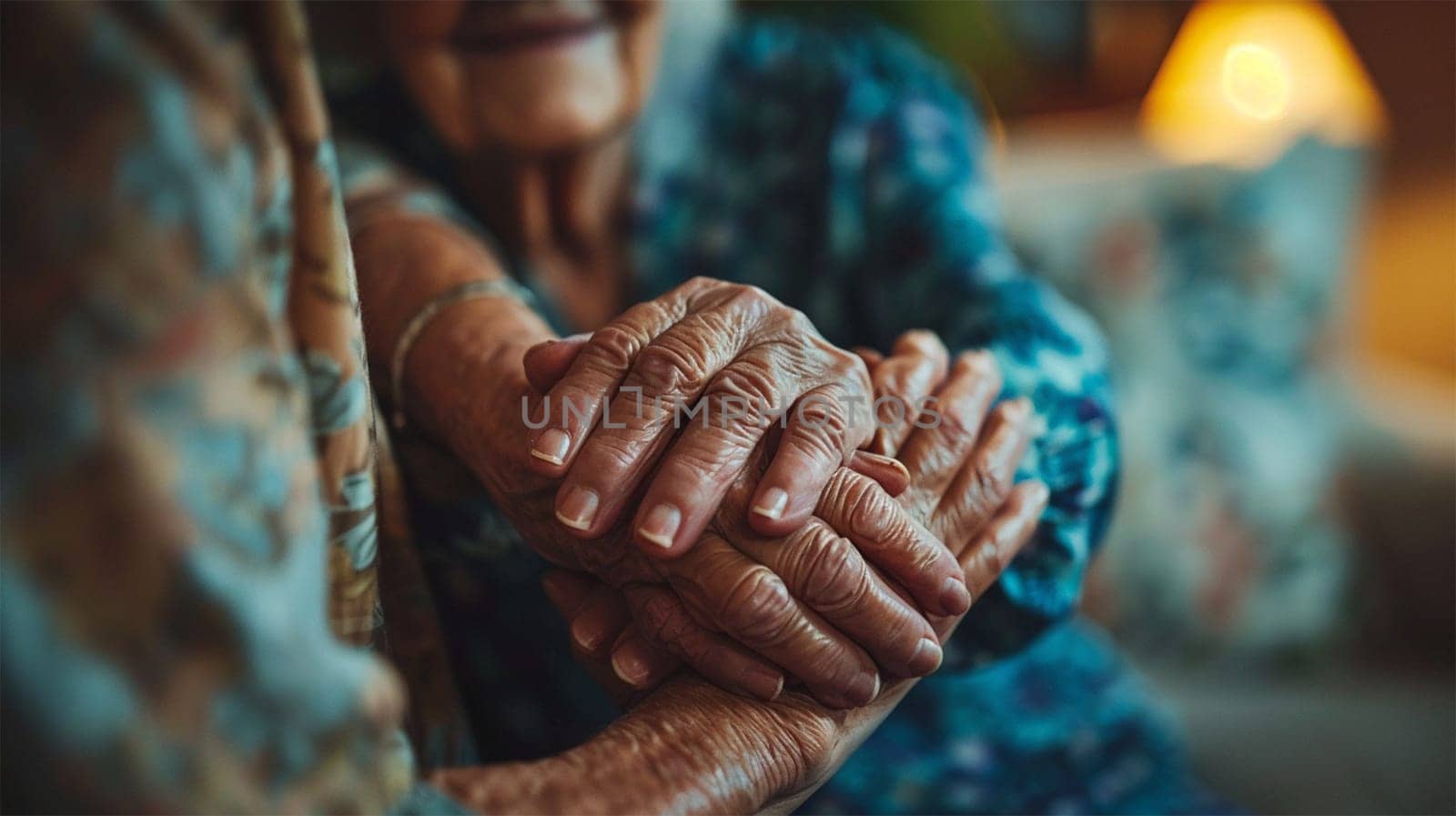 Close-up of seniors holding hands, symbolizing care, support, and affection in a cozy setting. Concept of support and human connection.
