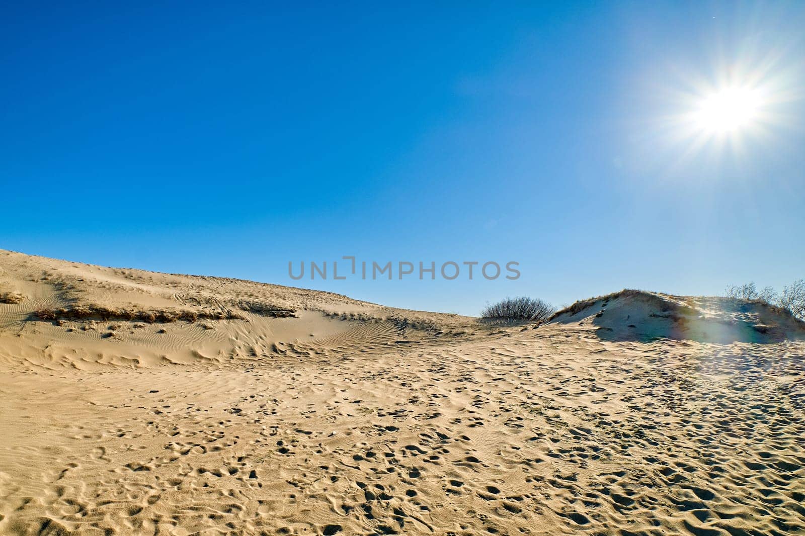 Nordic sand dunes, Baltic sea, Curonian spit, Nida, Klaipeda, Lithuania at sunset. Lines, rhythm and patterns of shadows and hills