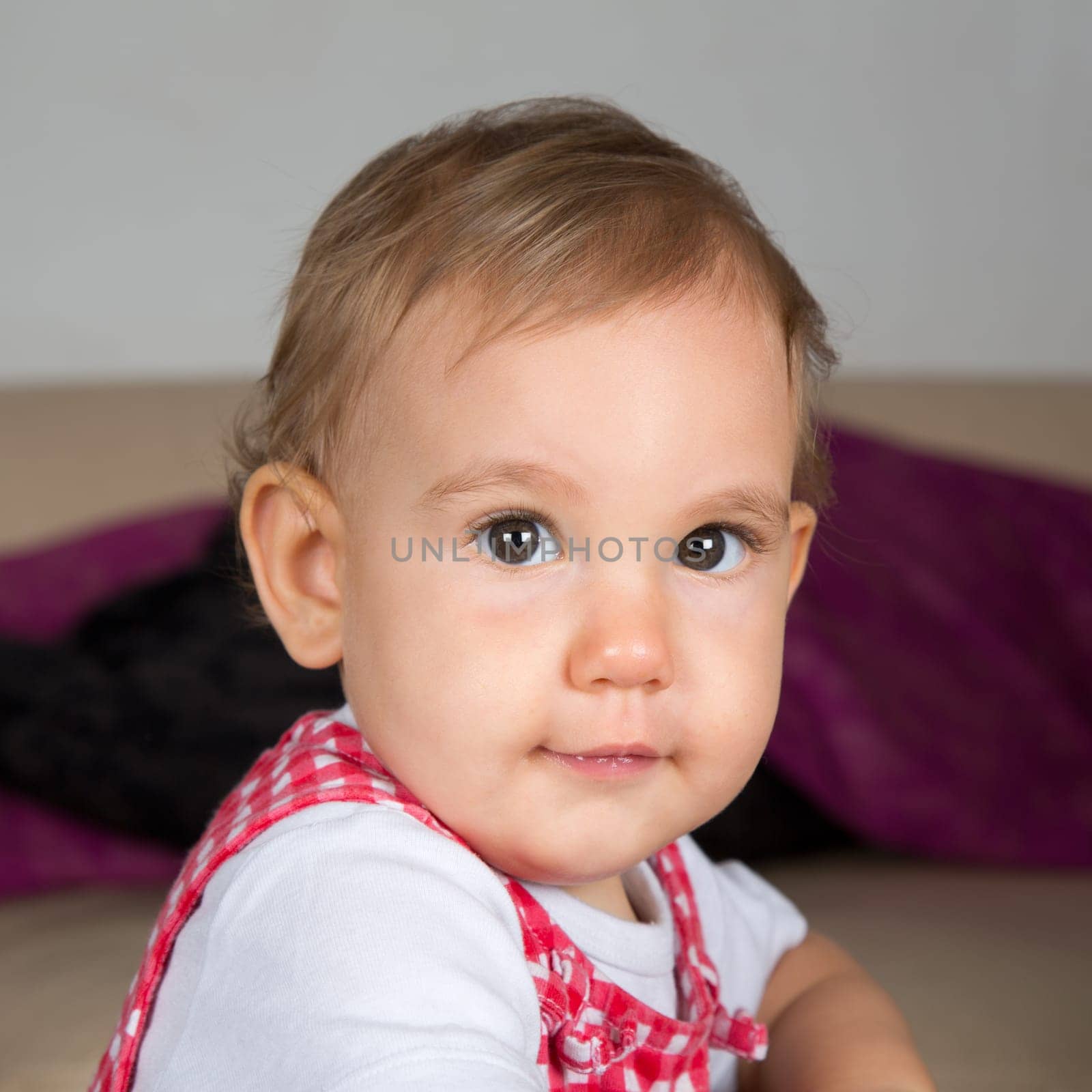 Portrait of a happy baby, smiling into camera