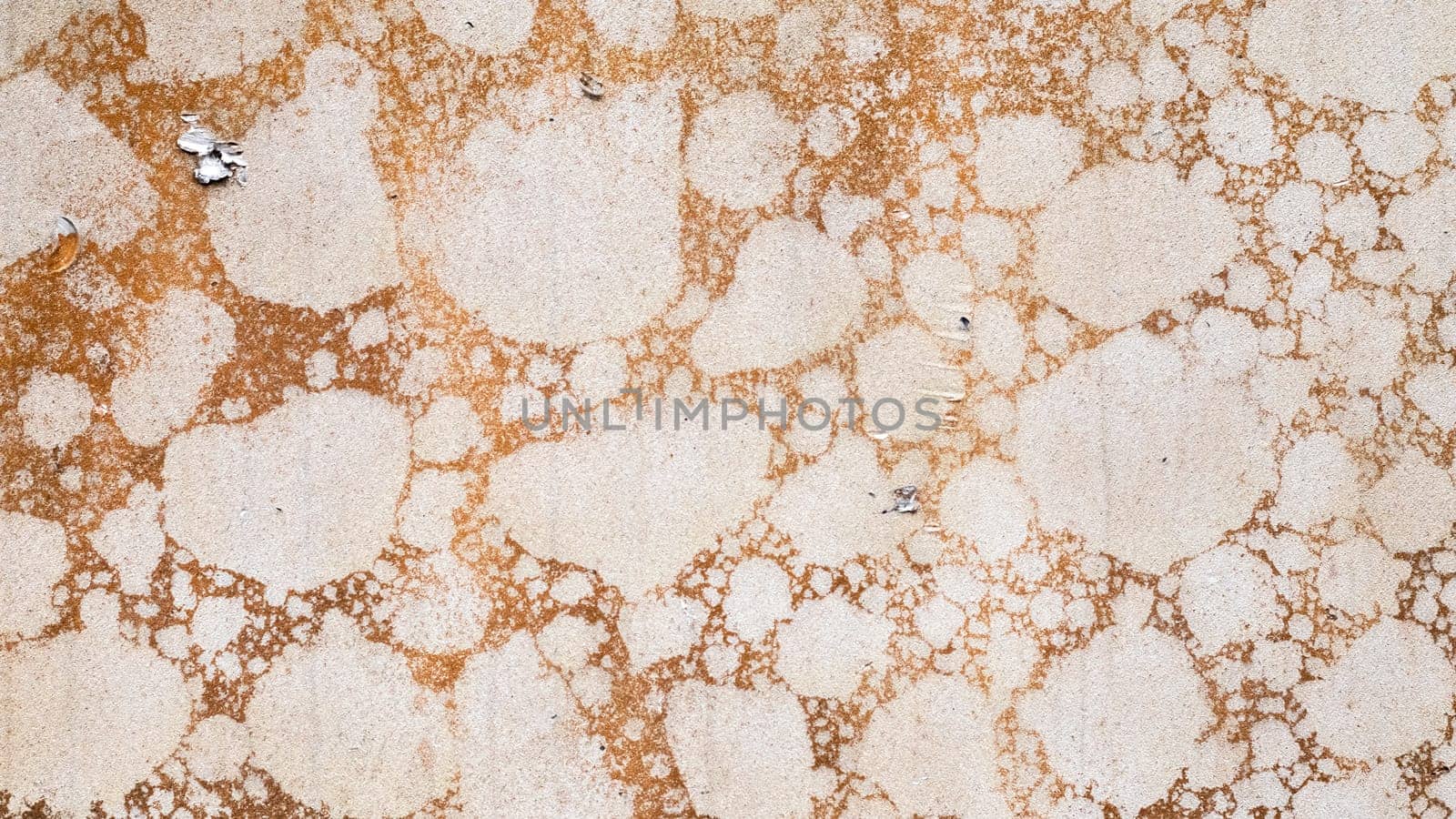 Texture of camouflage armored metal with damage close-up. Armor deformation from a shell close-up. Damaged armor of a Russian armored personnel carrier by shell fragments. War in Ukraine