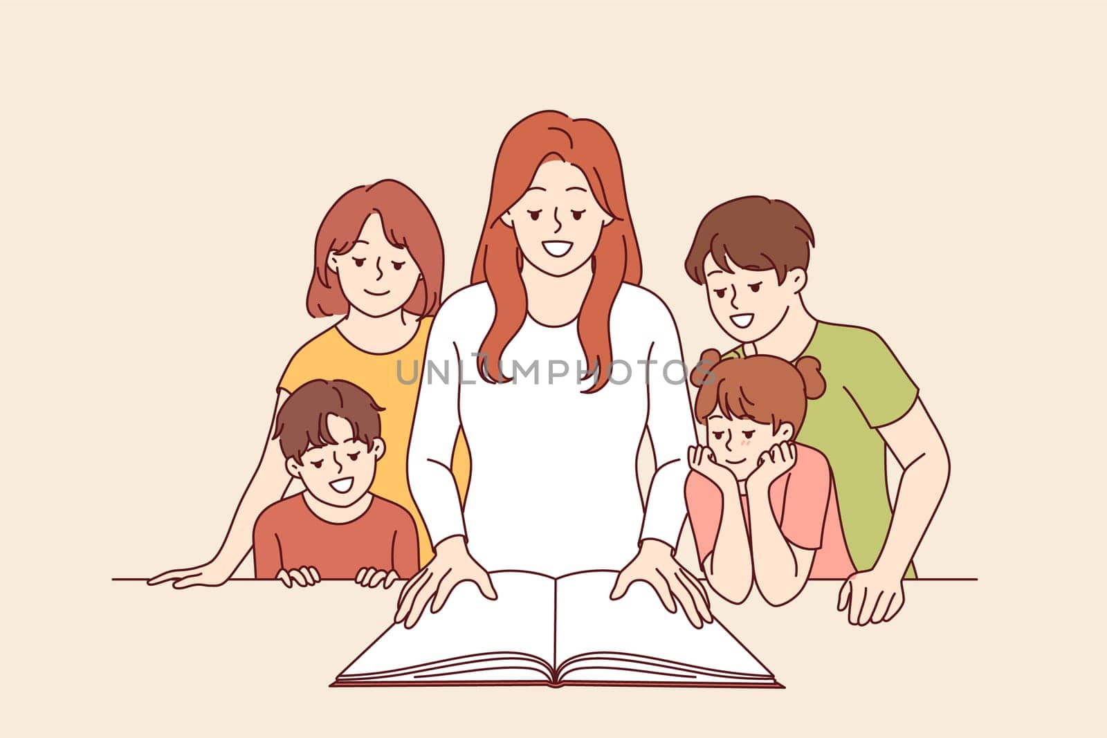 Woman teacher shows interesting book to happy children and smiles, rejoicing, giving kids knowledge. Children book for primary education and development of curiosity among elementary school students