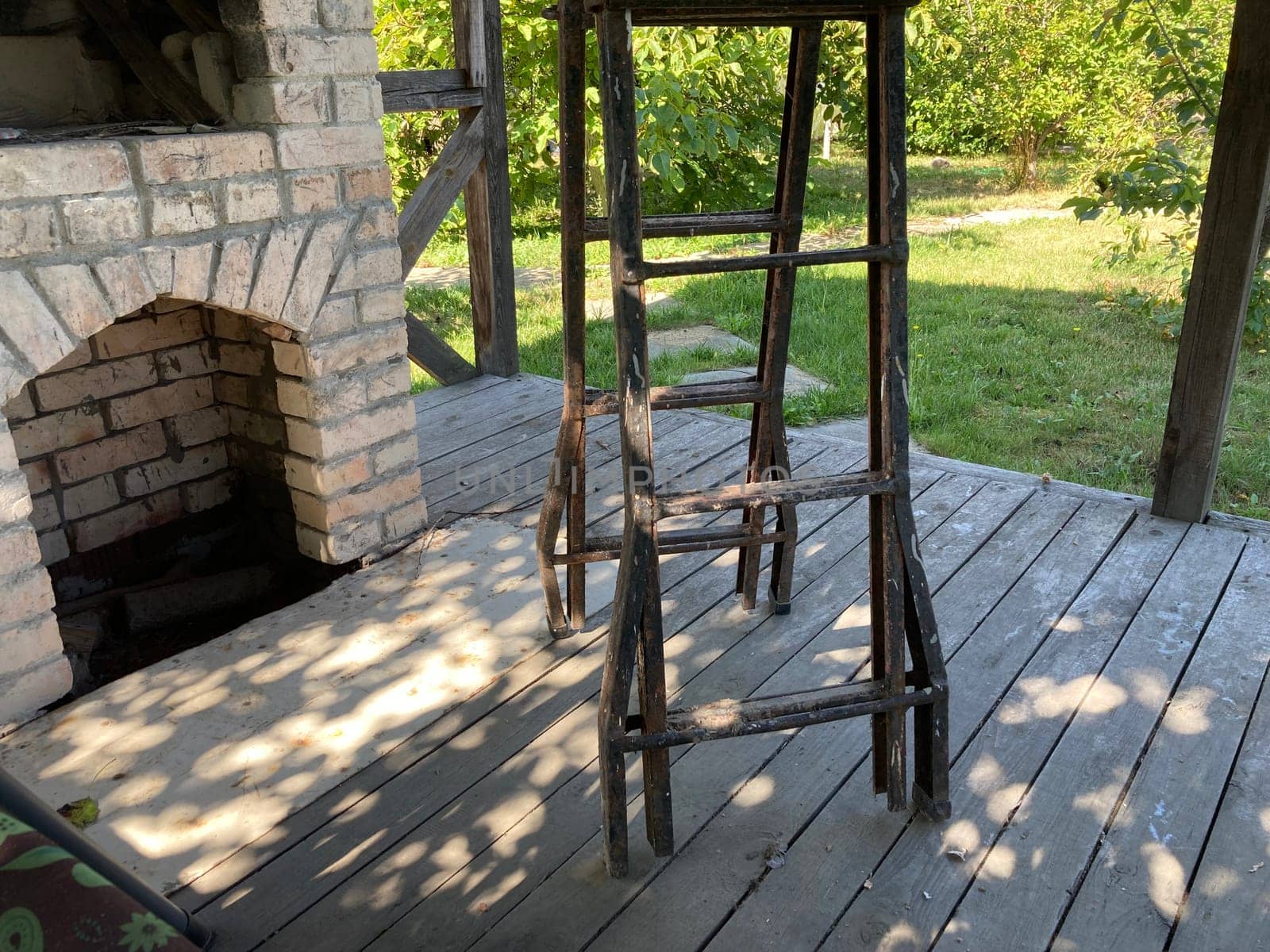 A stepladder stands on a the veranda