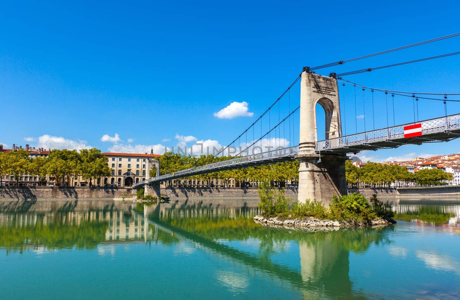 Old Passerelle du College bridge over Rhone river in Lyon, France. Summer day