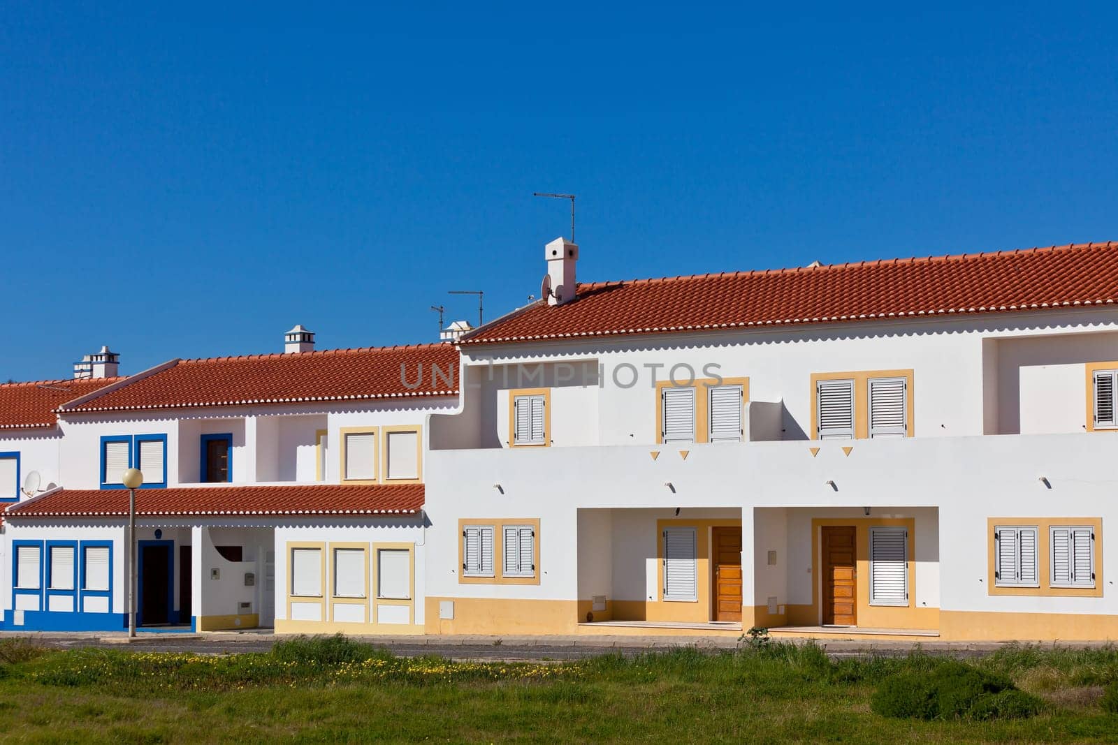 Unrecognizable Part of Residential House at Algarve, Portugal. Bright Blue Sky as a Background