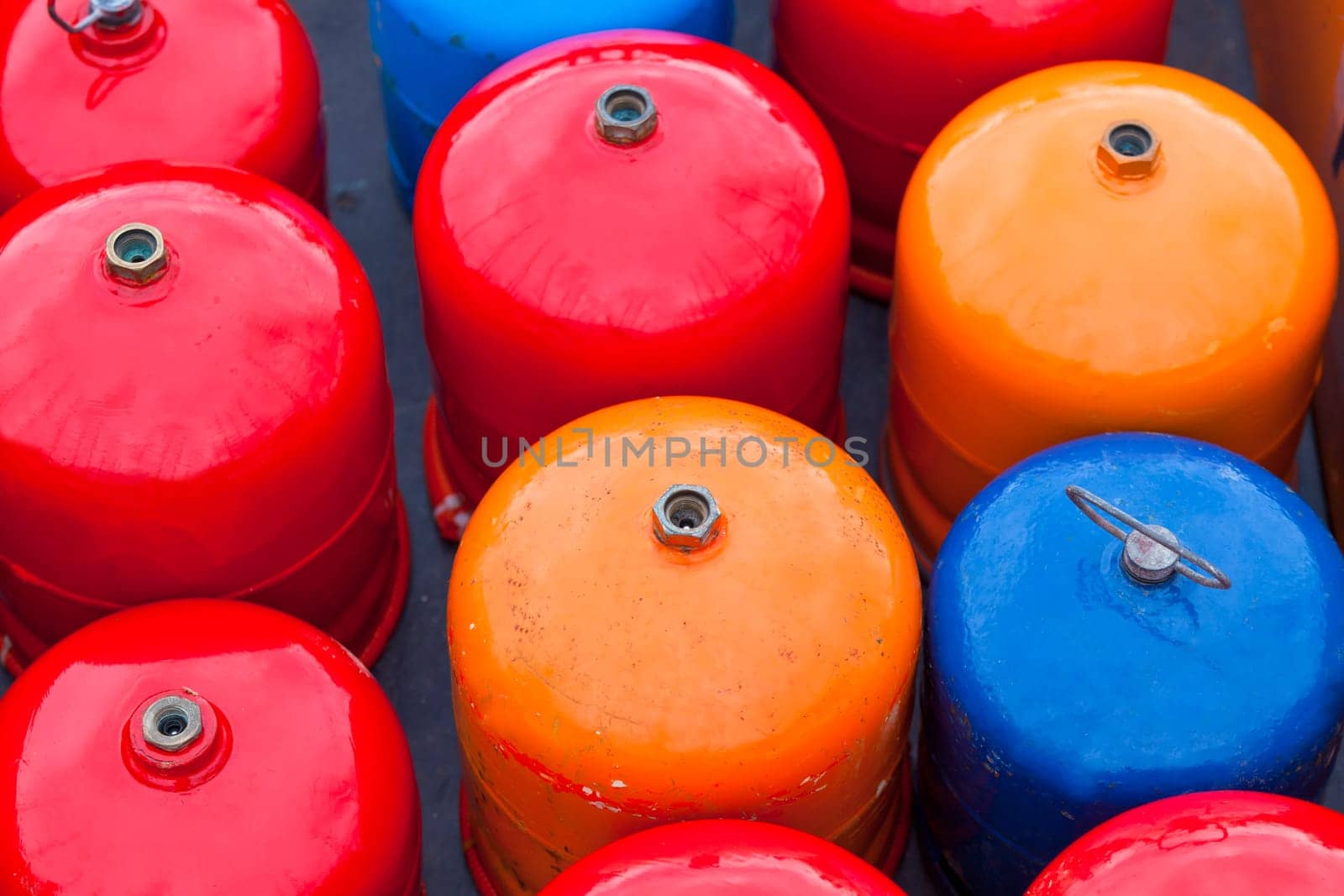 Bright metal gas bottles. Horizontal outdoor shot