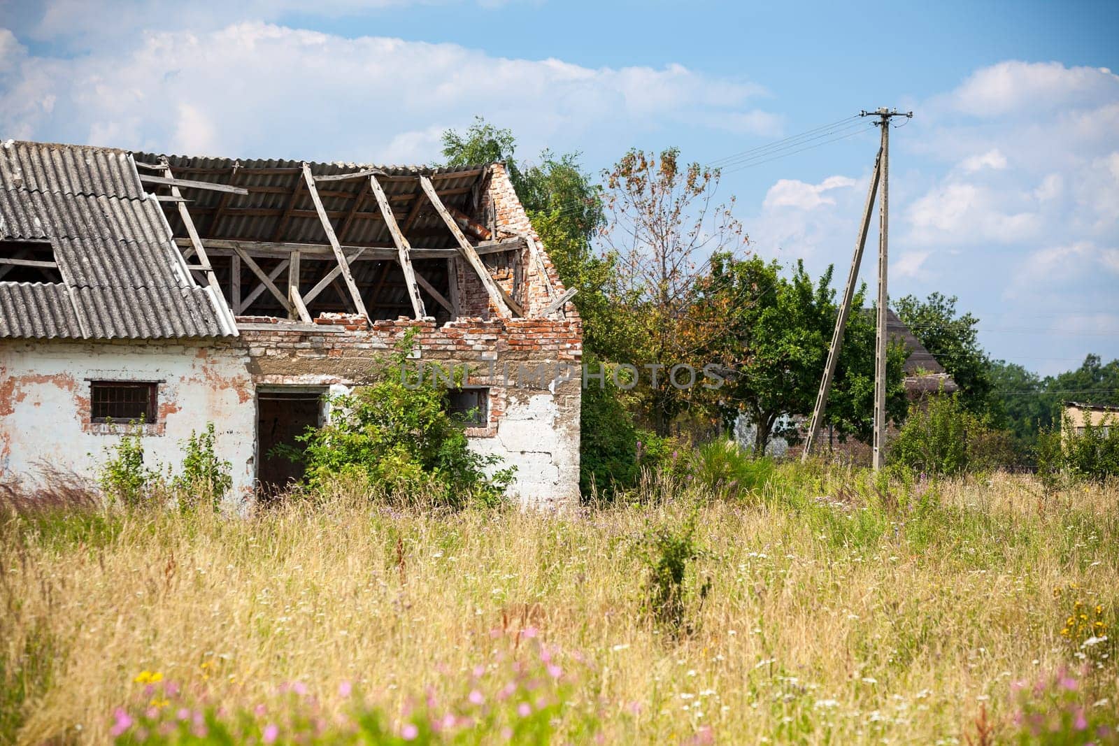 Abandoned farm house in a field. Horizontal shot