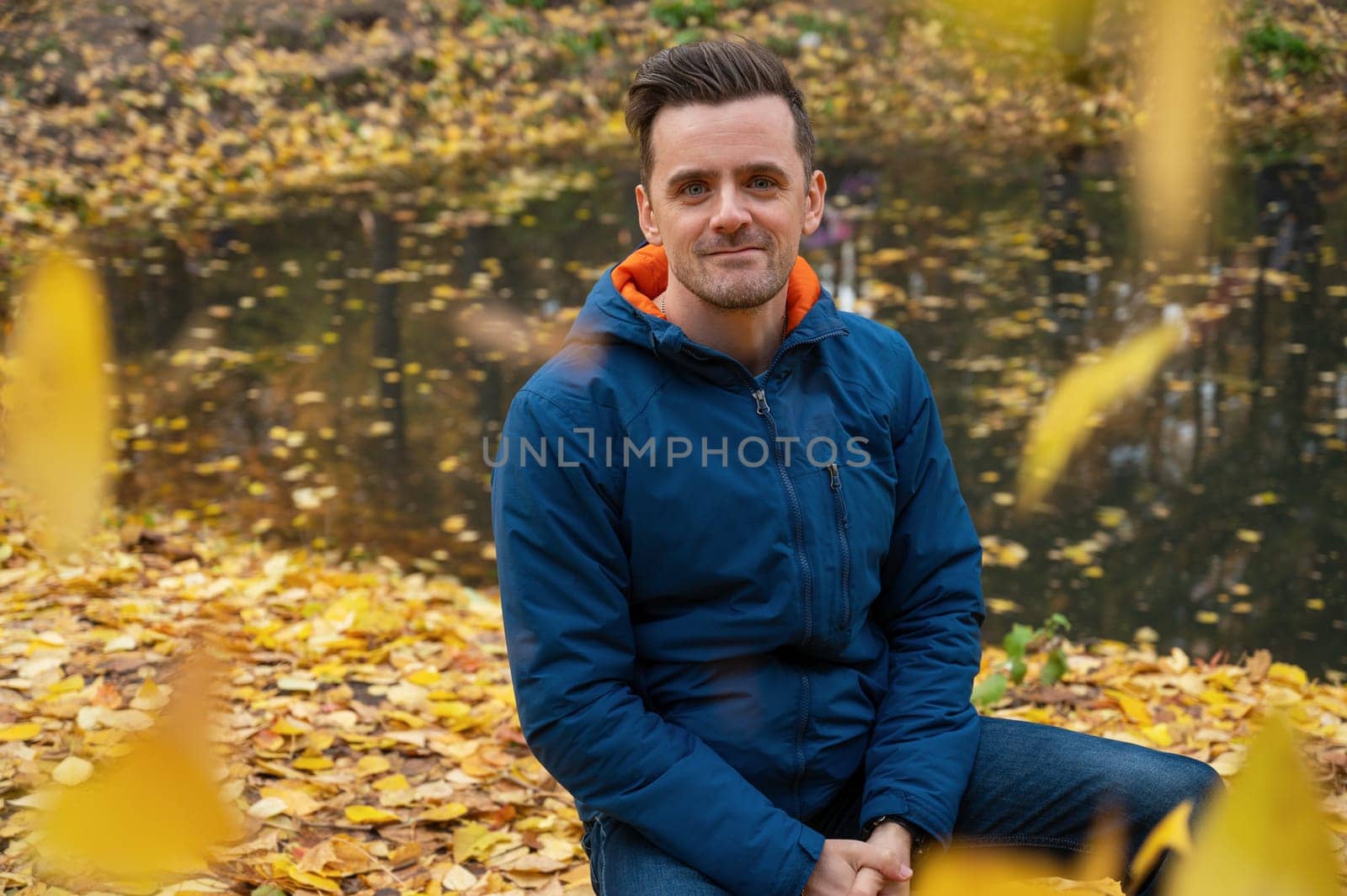 Autumn portrait of man on fall nature background