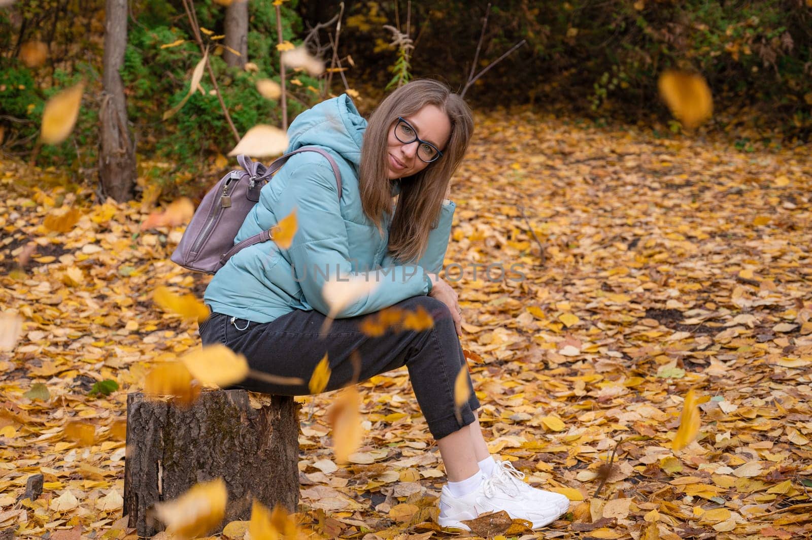 Autumn portrait of beautiful woman on fall nature background